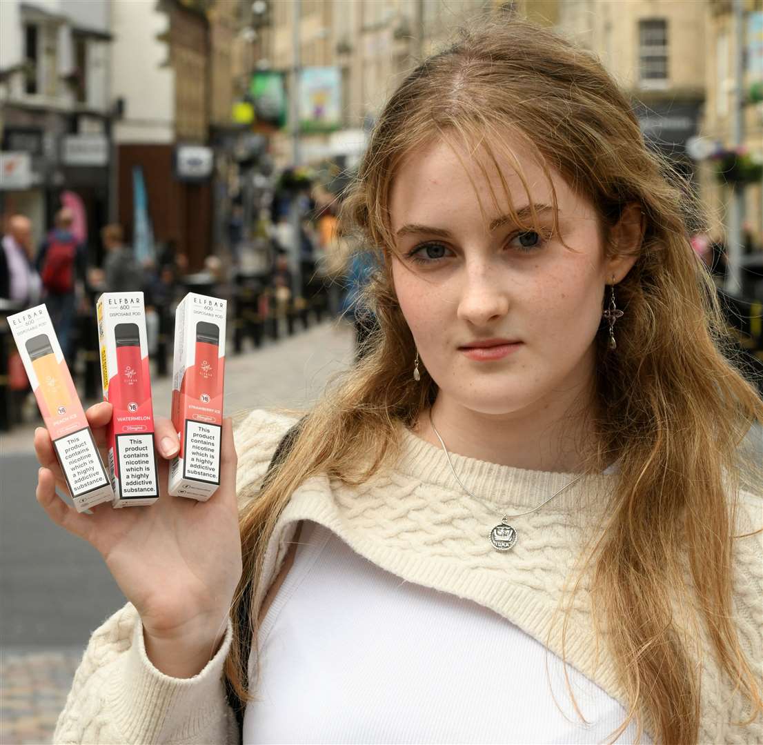 Iona MacDonald holding the vapes she was able to purchase underage. Picture: James Mackenzie.