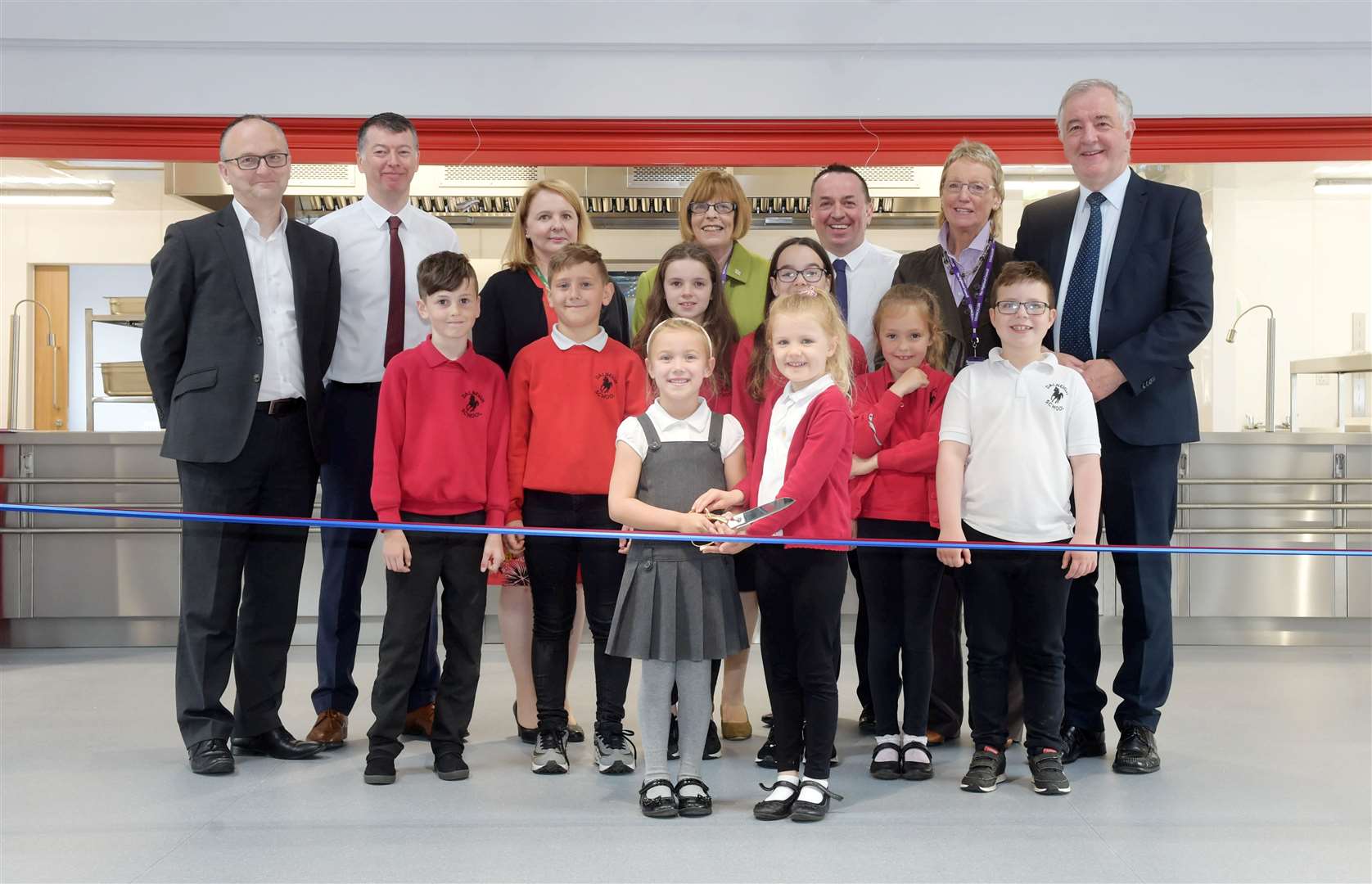 Pupil council members along with Highland councillors and council officers at the opening of Dalneigh Primary's new dining hall and kitchen...Picture: Callum Mackay. Image No. 044174.