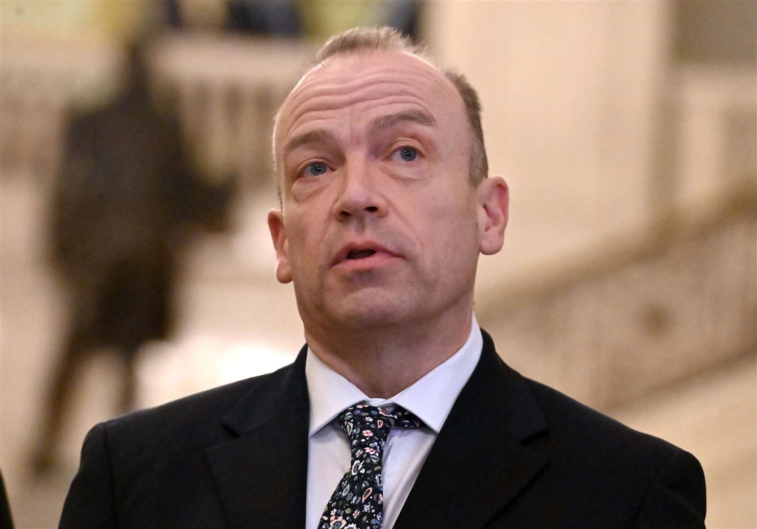 Northern Ireland Secretary Chris Heaton-Harris speaking to the media at the Northern Ireland Assembly (Oliver McVeigh/PA)