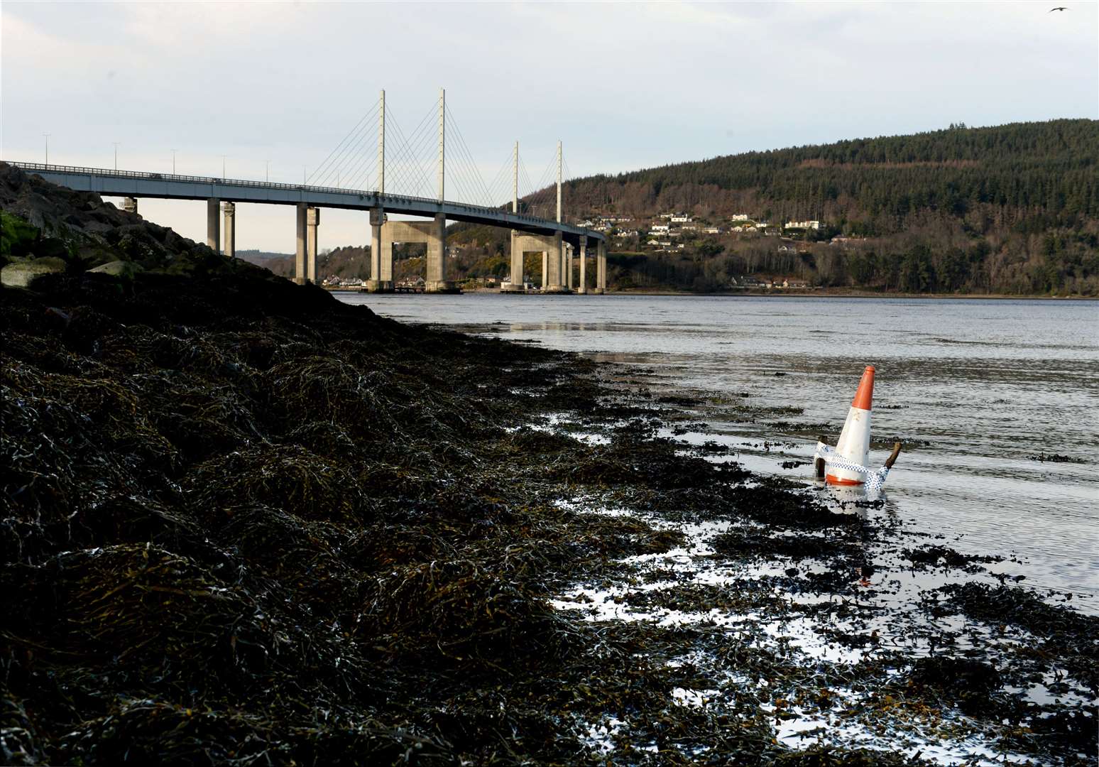 A cone, left by the coastguard, marks the spot where the suspected device was discovered yesterday around 100m from the Kessock Bridge.