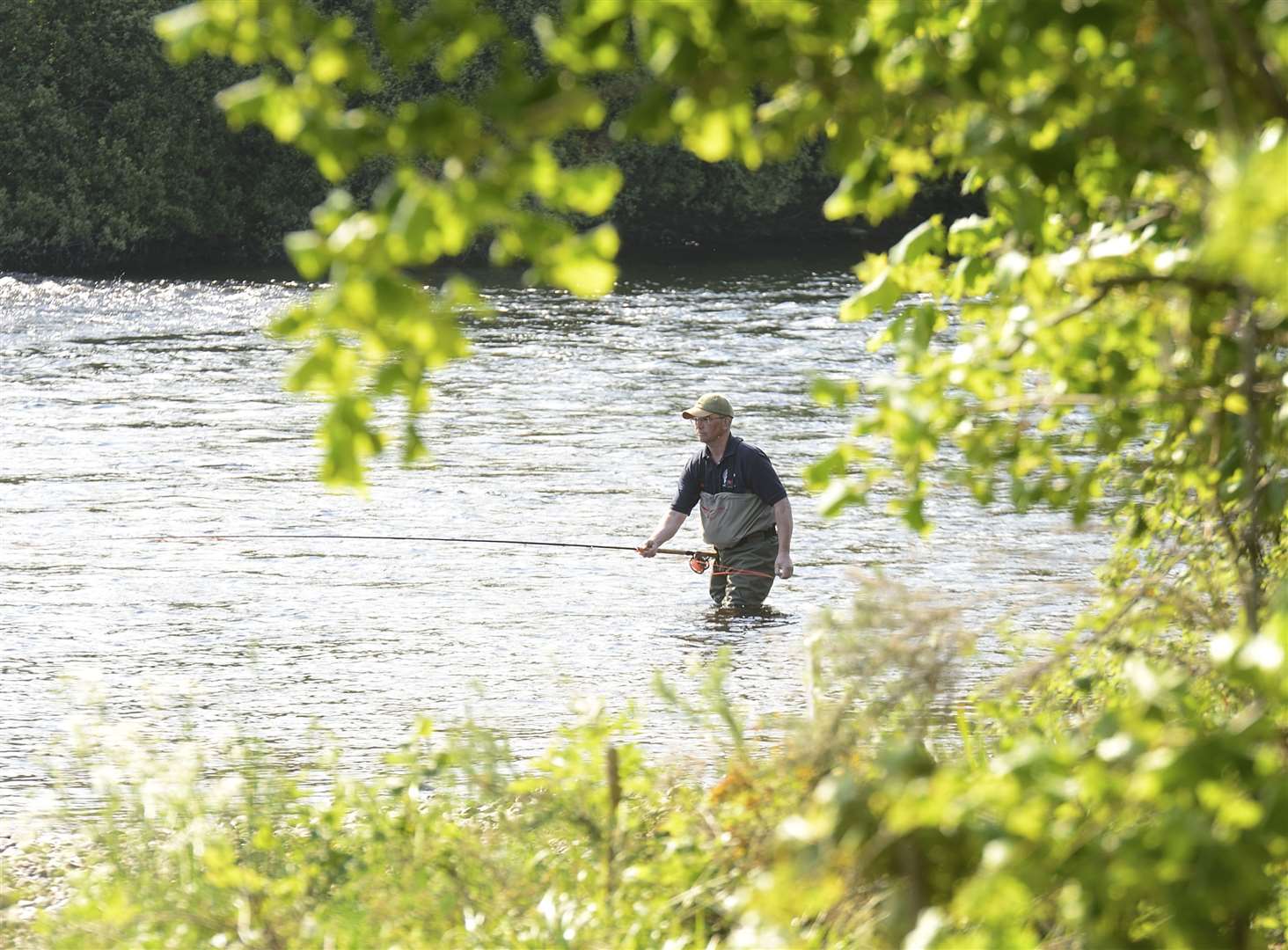An angler in the River Ness during warmer times. Picture: Gary Anthony.