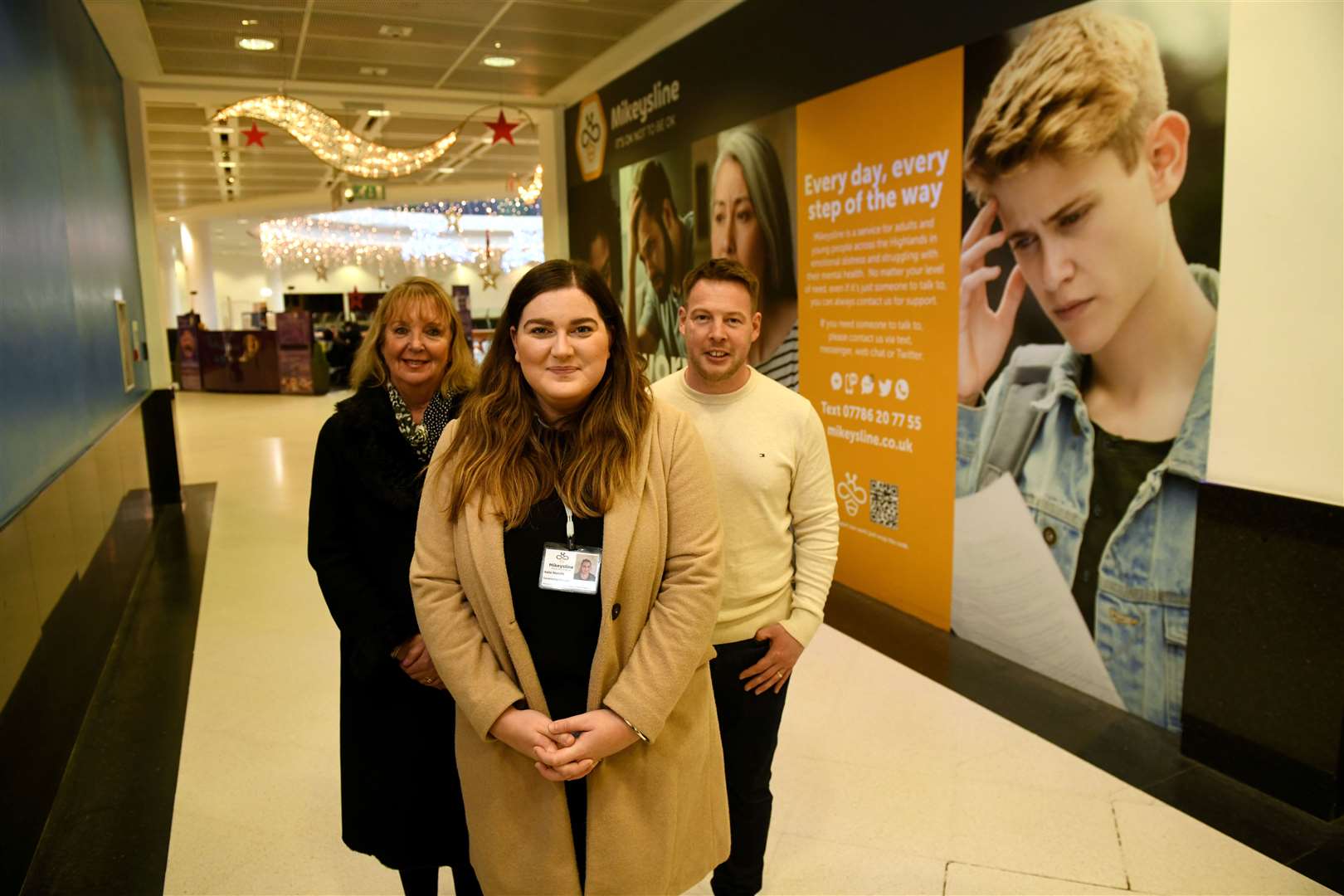 Jackie Cuddy, Eastgate Centre Manager, Katie Melville, Mikeysline Fundraising Manager and Mark Harper, Acorn Signs Director in front of the new poster. Picture: James Mackenzie.