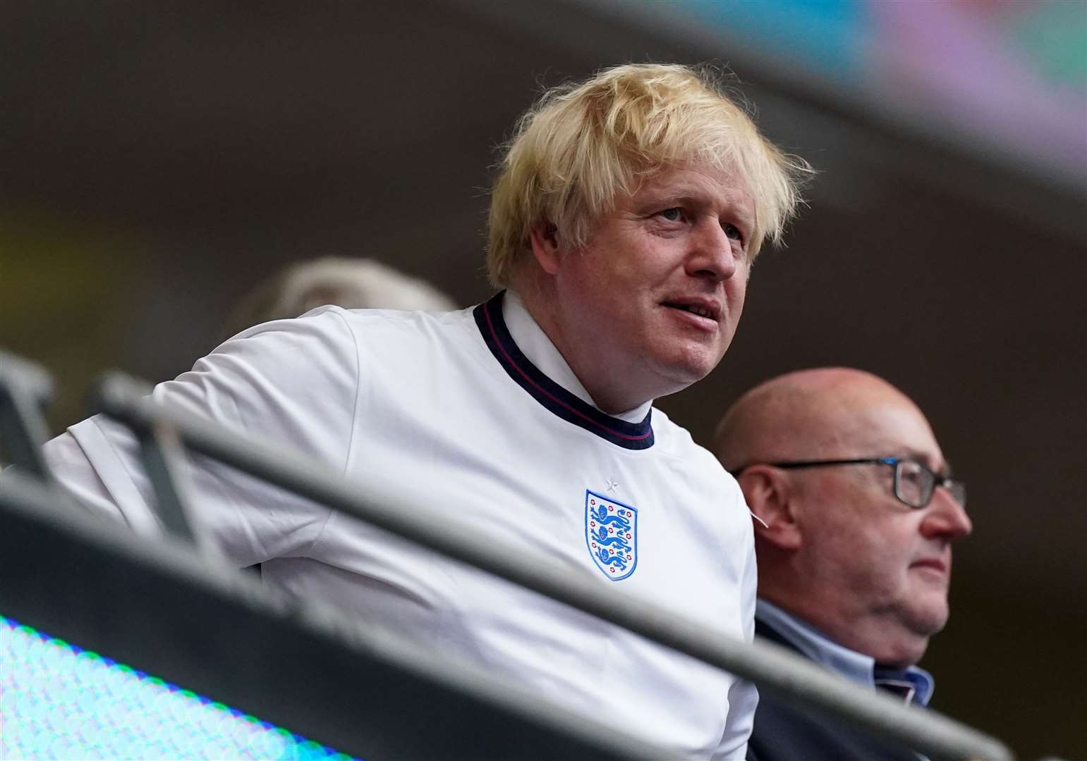 In a swipe at Boris Johnson, Sir Keir Starmer said ‘real fans’ do not wear an England top over a shirt and tie (Mike Egerton/PA)