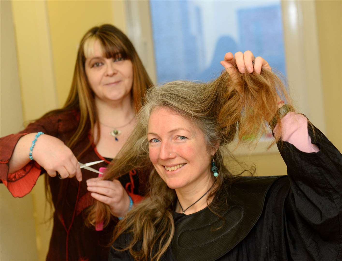Elizabeth Marsden who is raising money for the Mind charity with the help of hairdresser Rachel Jane Milne. Picture: Gary Anthony.