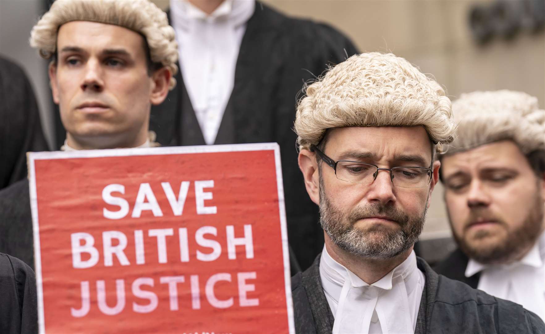 Barristers on strike outside Leeds Combined Court on Monday, as more than 80% of barristers polled voted in favour of strike action (Danny Lawson/PA)