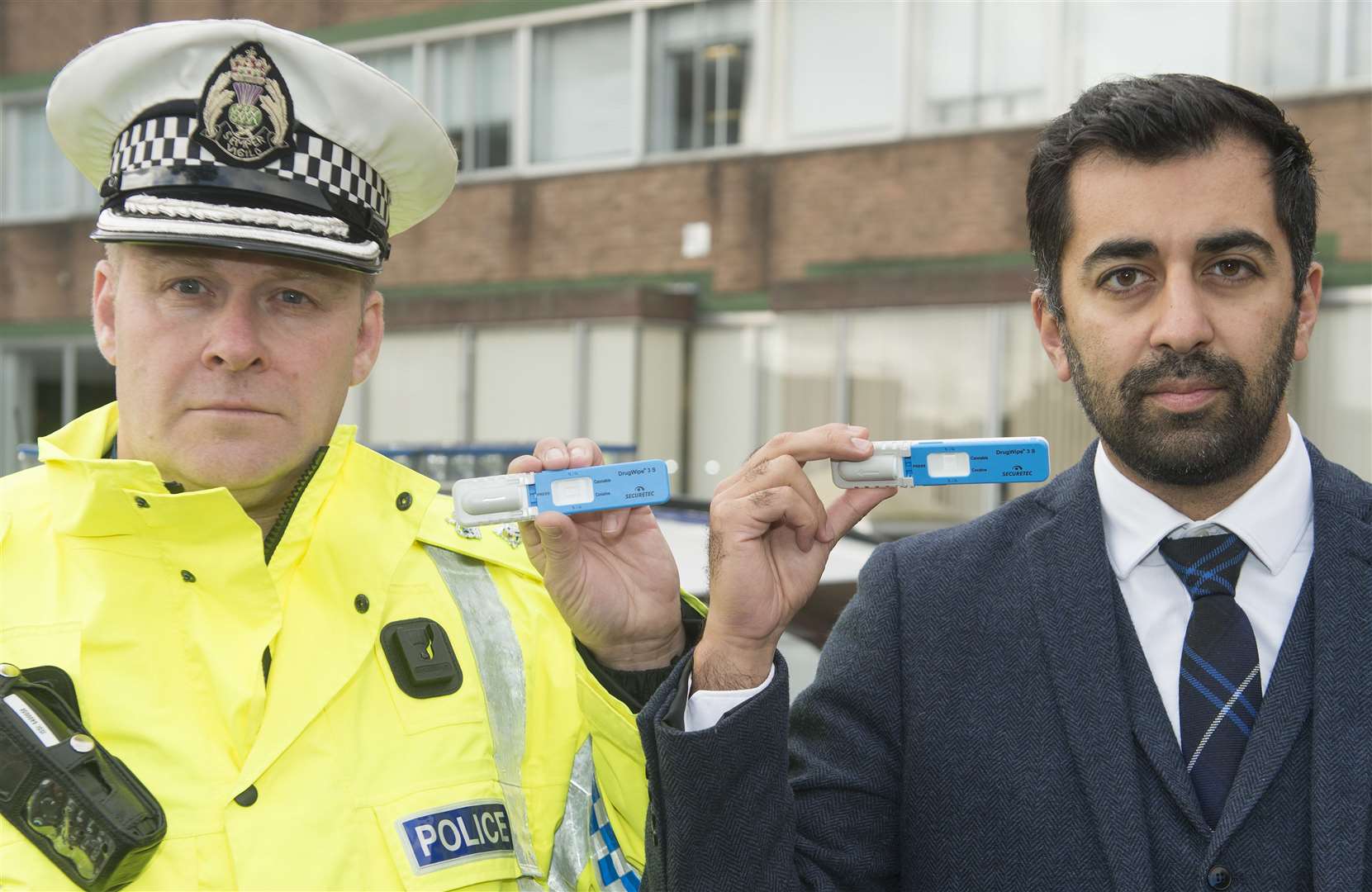 Chief Superintendent Stewart Carle, Head of Road Policing with justice secretary Humza Yousaf, each holding Drugswipe testing kits. Picture: Neil Hanna Photography