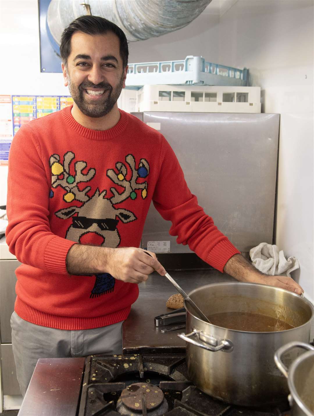 First Minister of Scotland Humza Yousaf prepares lunch for older people who are at risk of isolation and loneliness over the festive period (Lesley Martin/PA)