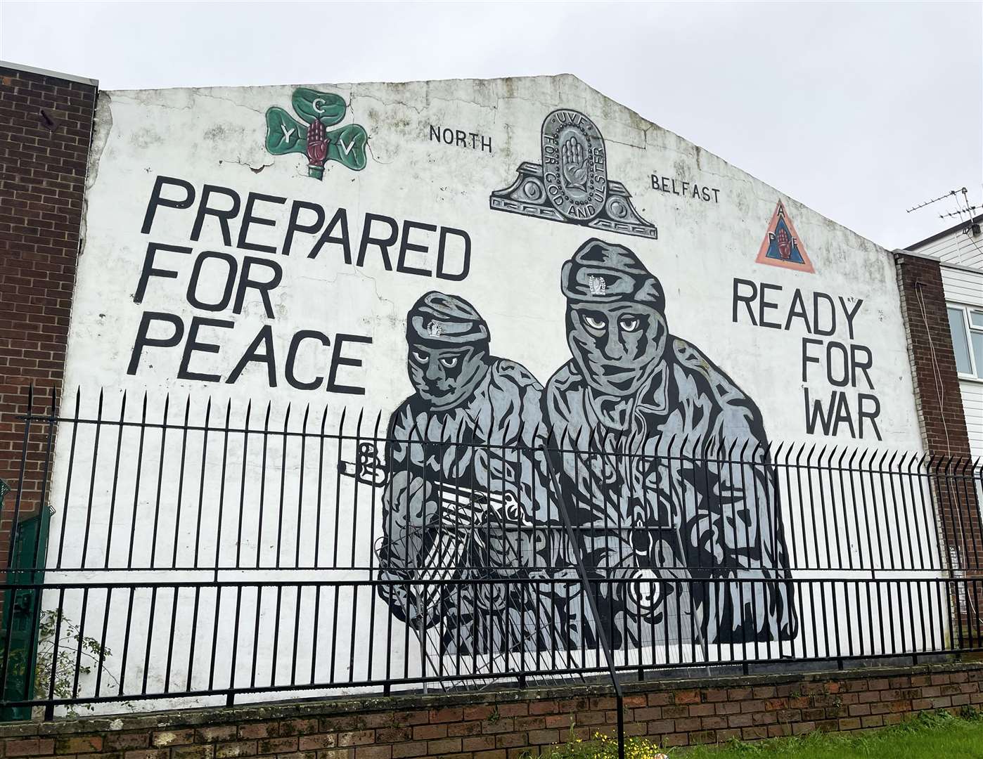 An Ulster Volunteer Force (UVF) mural on a wall at the entrance of the loyalist Mount Vernon housing estate in north Belfast (Liam McBurney/PA)