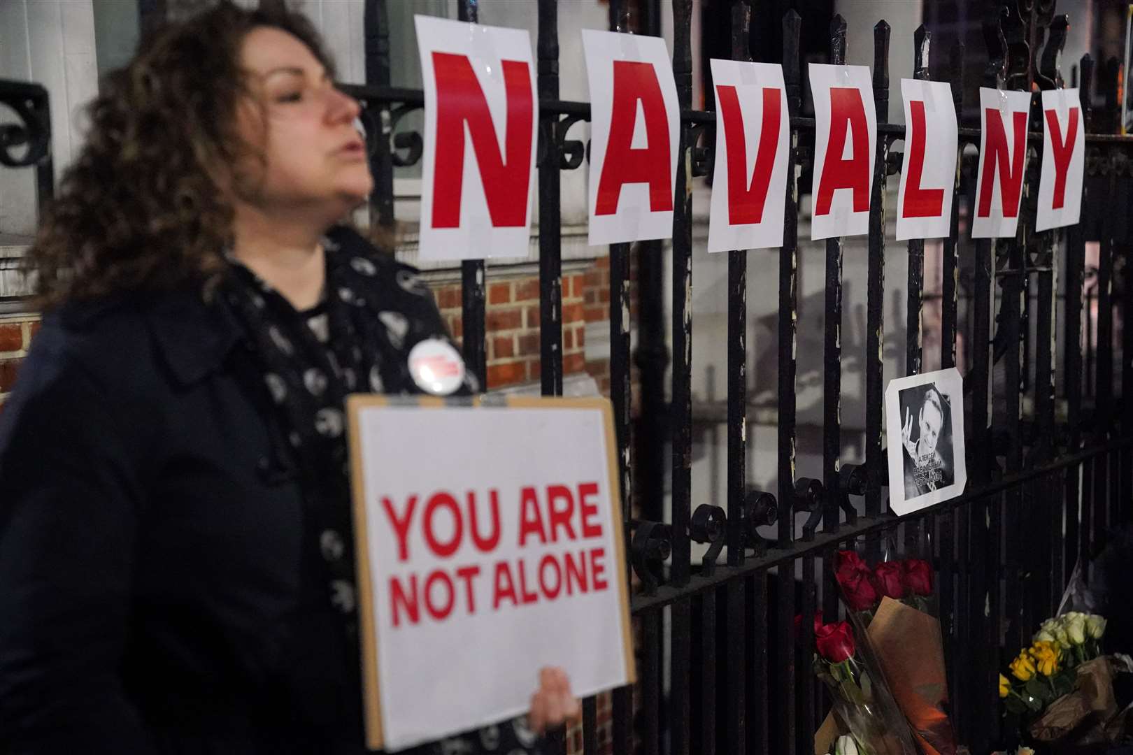 People take part in a protest opposite the Russian Embassy in London (Jonathan Brady/PA)