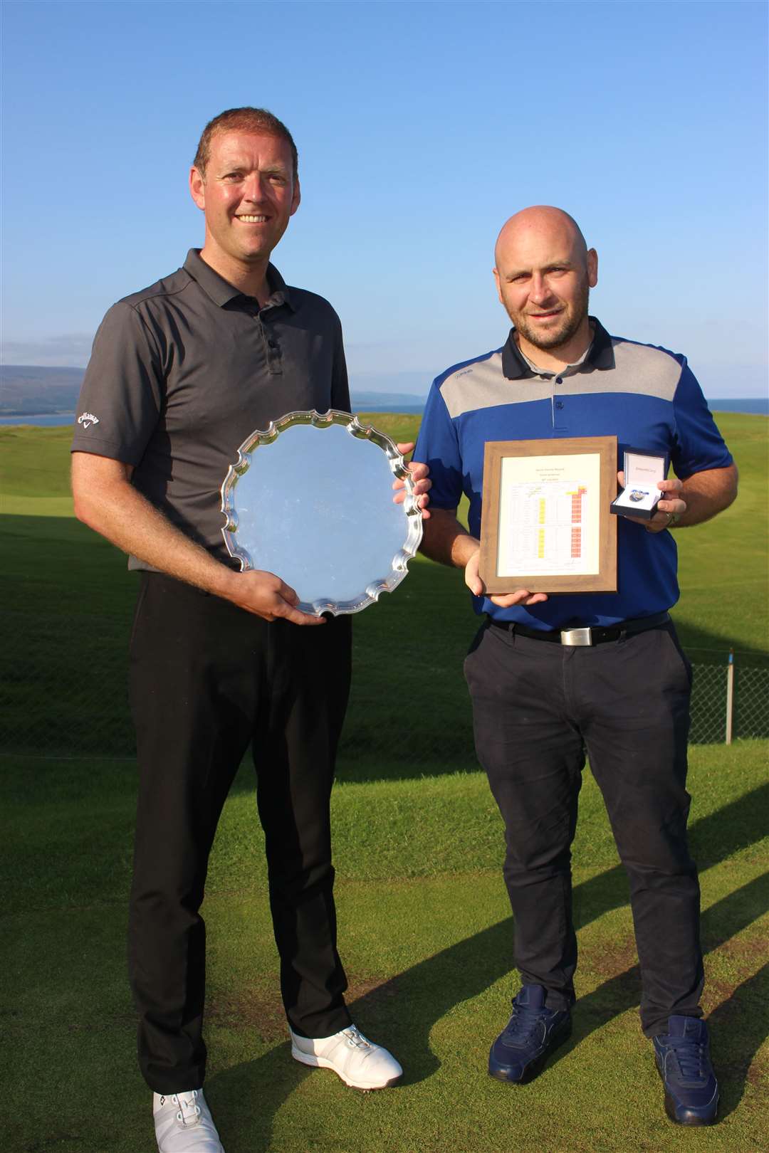 Brora Salver winner David Joel (left) and right David Sanderson with W J Henderson medal and Course record framed card.