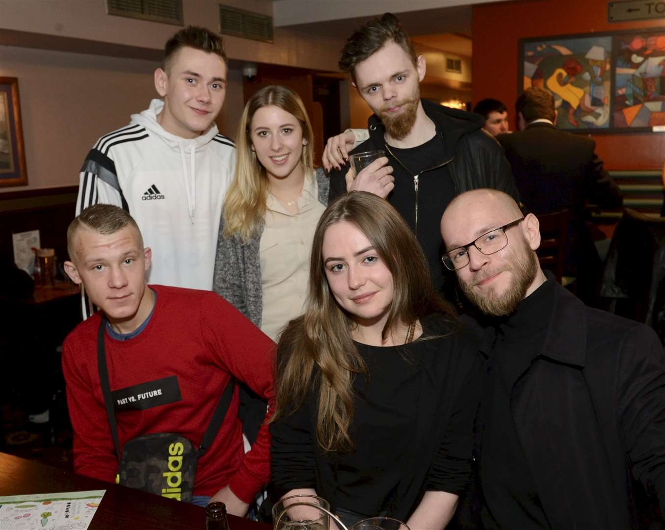 Maciej Jagielo (right, back) on his 21st birthday celebration with friends. Picture: Gary Anthony.