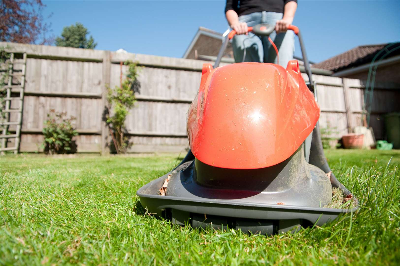 Mowing the lawn for 20 minutes can use almost 100 calories. Picture: iStock/PA