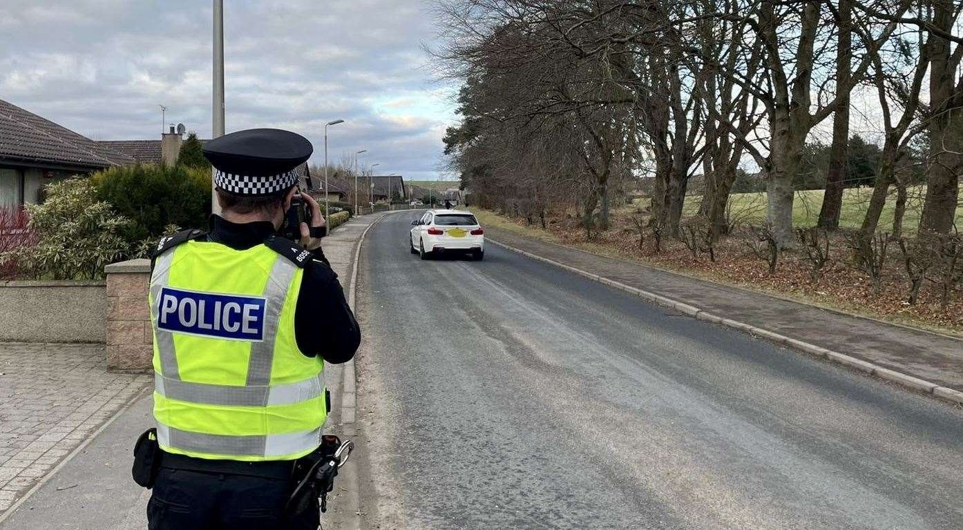 Officers from Police Scotland carrying out speed checks.