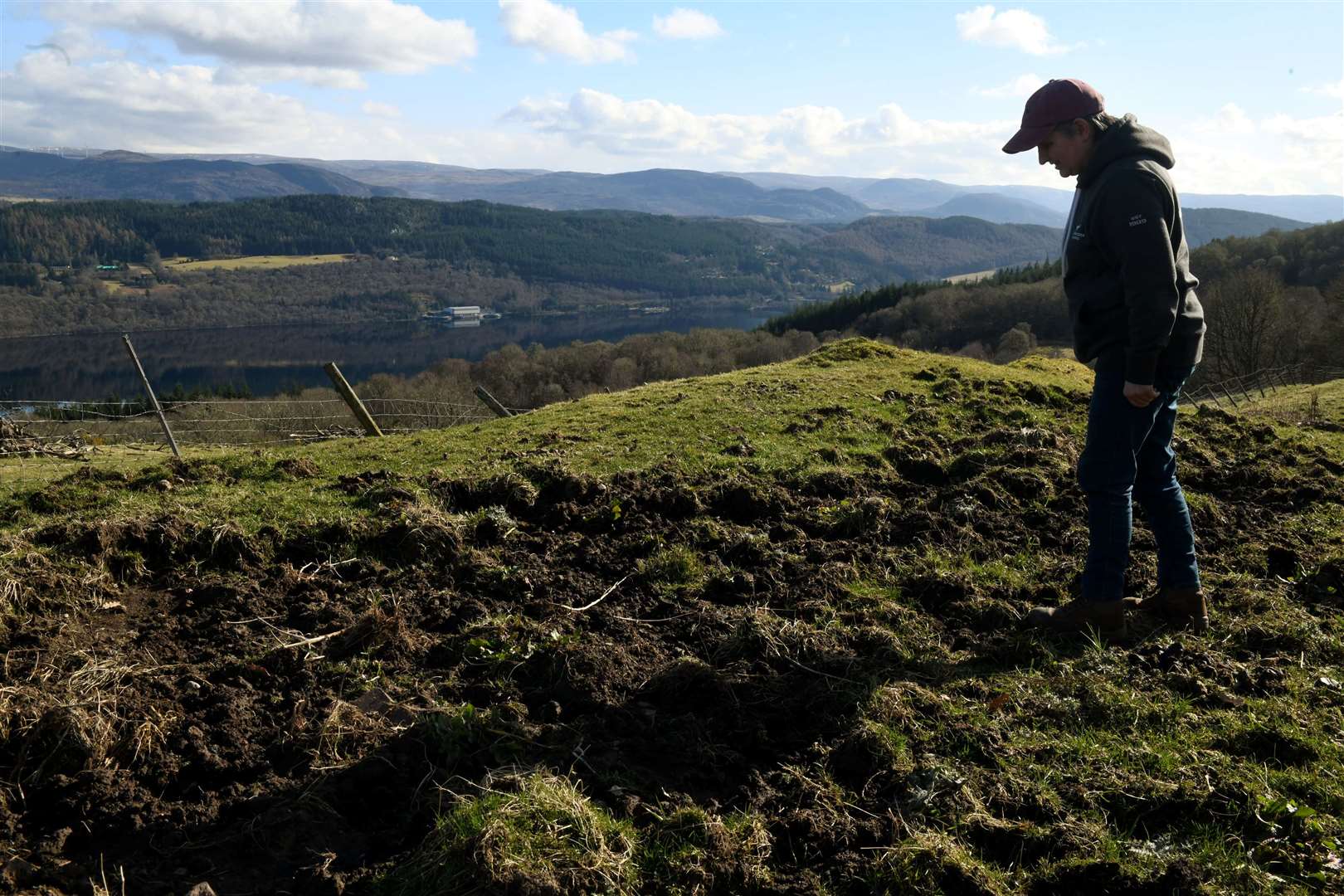 Catherine McLennan inspects the damaged grazing land. Picture: James Mackenzie.