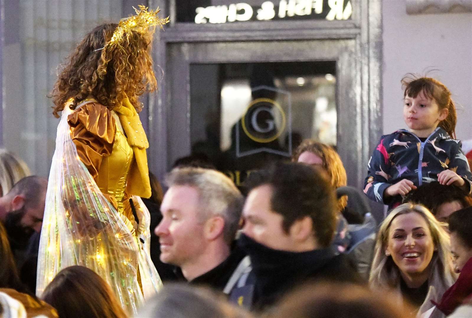 Tall angel walking through the crowd. Picture: James Mackenzie.