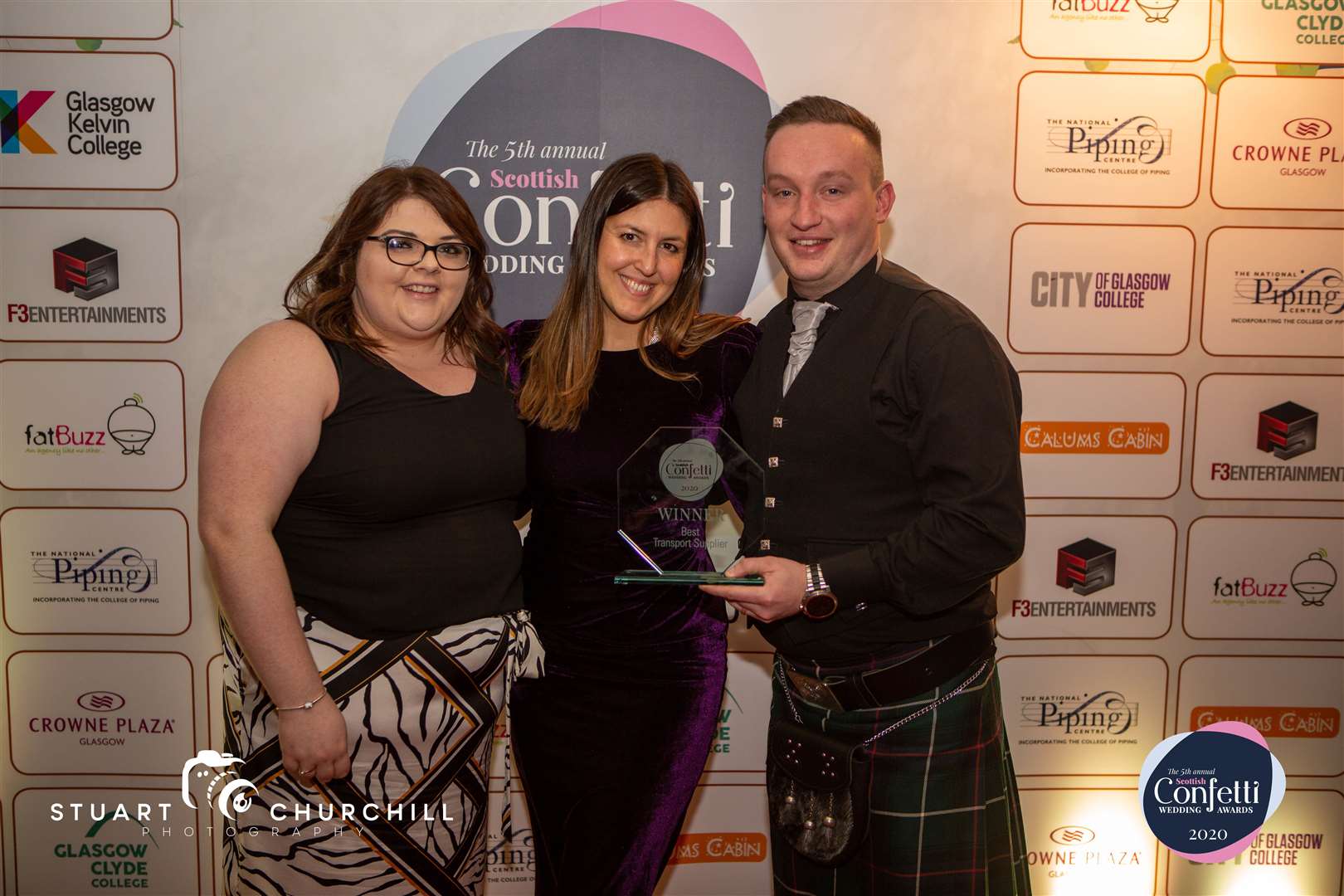Amy Mathieson (left) receives the award from Eleanora Vanello, of event organisers Paramount Creative and MC Des Clarke.