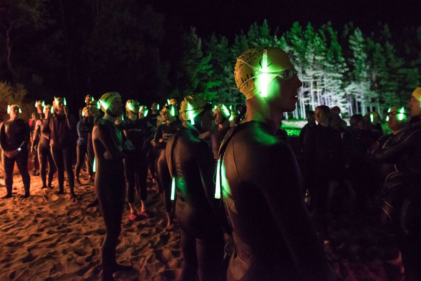 Swimmers wait to enter the water at the start of the Starman Night Triathlon. Picture: Ed Smith Photography