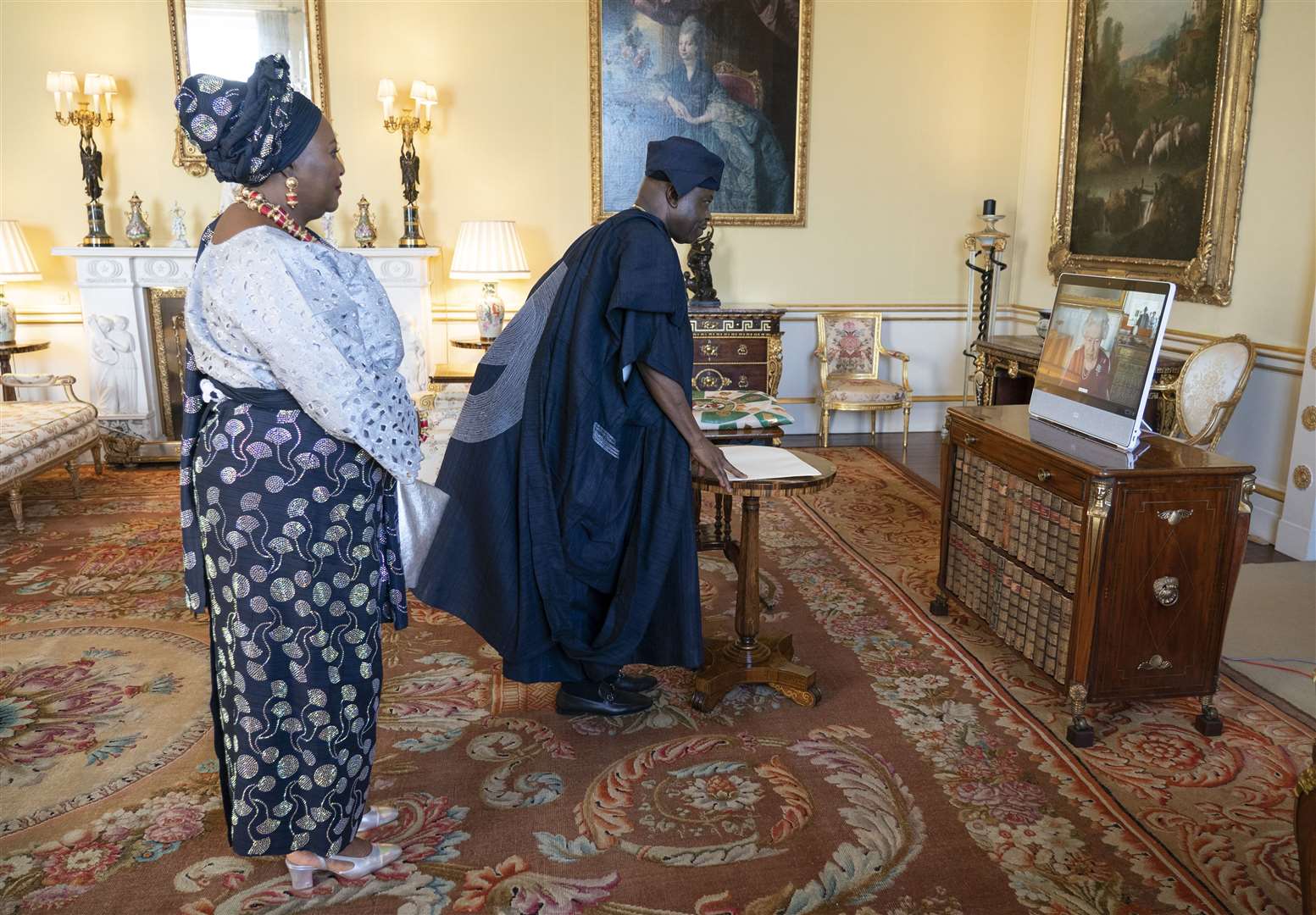 The Queen appears on a screen via video-link from Windsor during a virtual audience with Nigerian High Commissioner Sarafa Tunji Isola and his wife (Dominic Lipinski/PA)