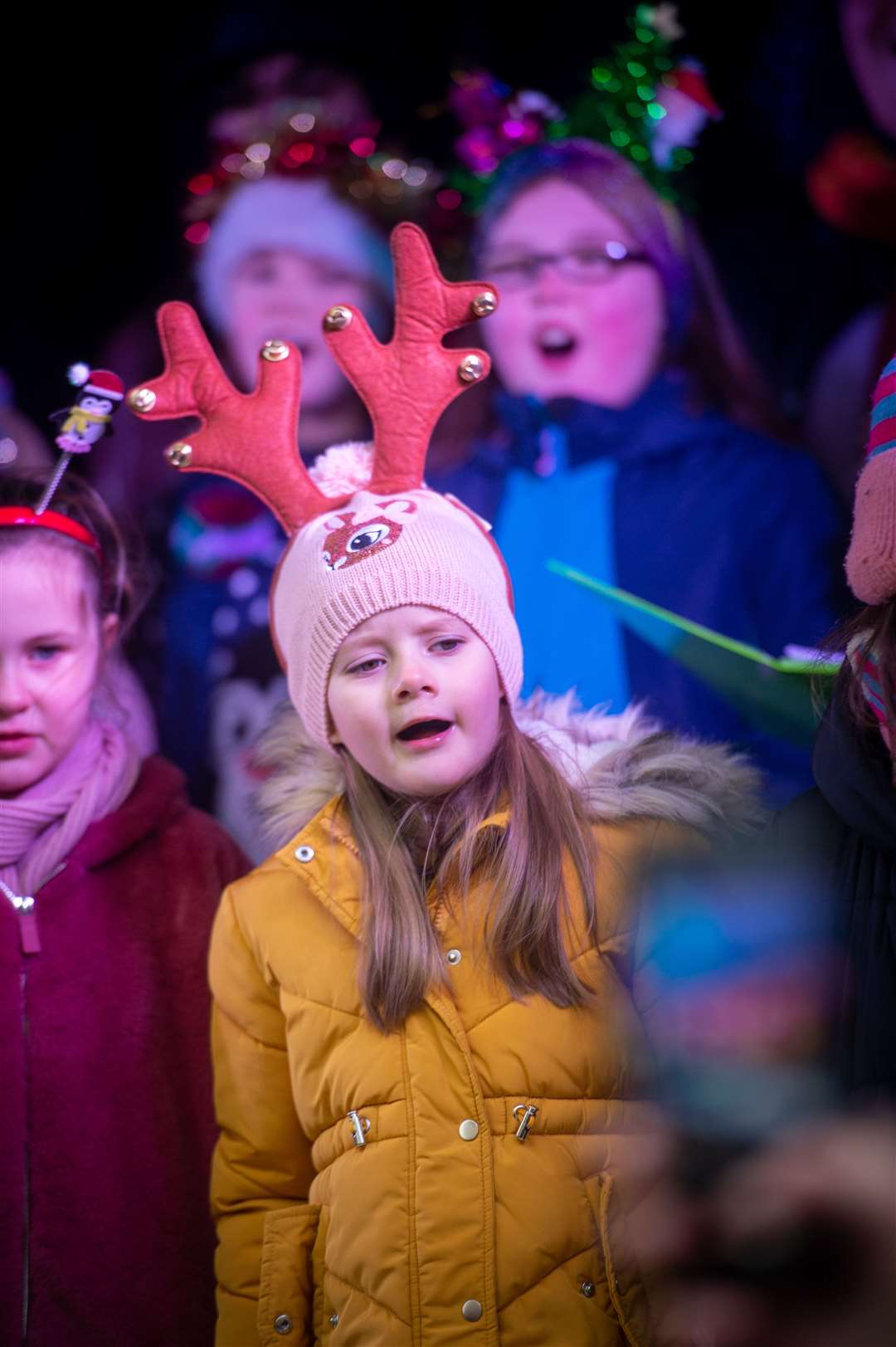 Local children sang Christmas songs for the crowds. Picture: Callum Mackay