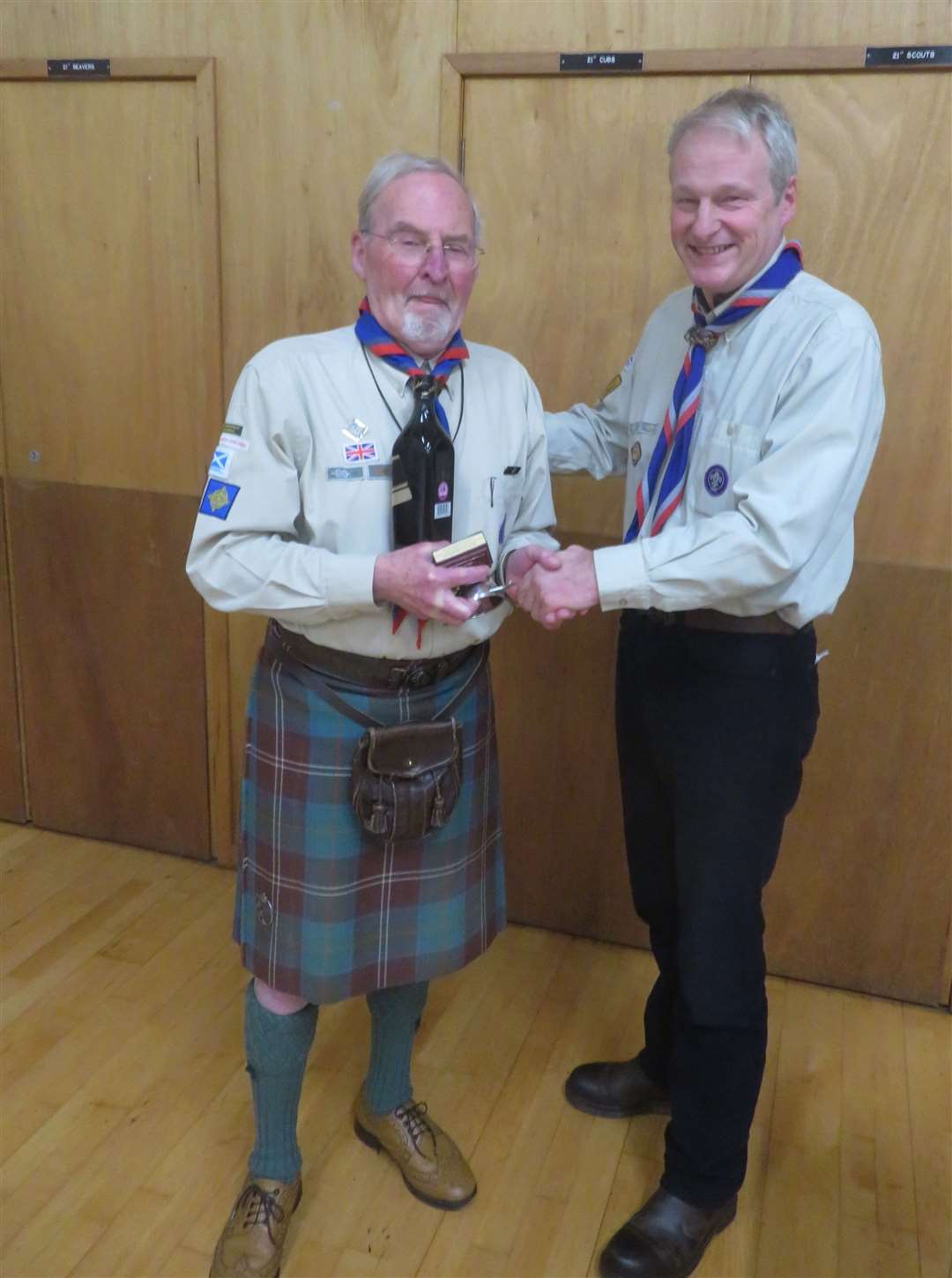 Duncan Chisholm being presented with a quoich by Group Scout Leader Eivor Dempster.