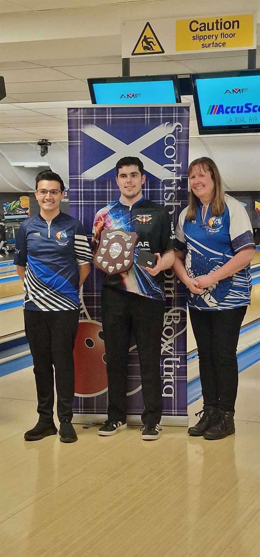 Aiden Smith, Rollerbowl's national champion, with his silverware.