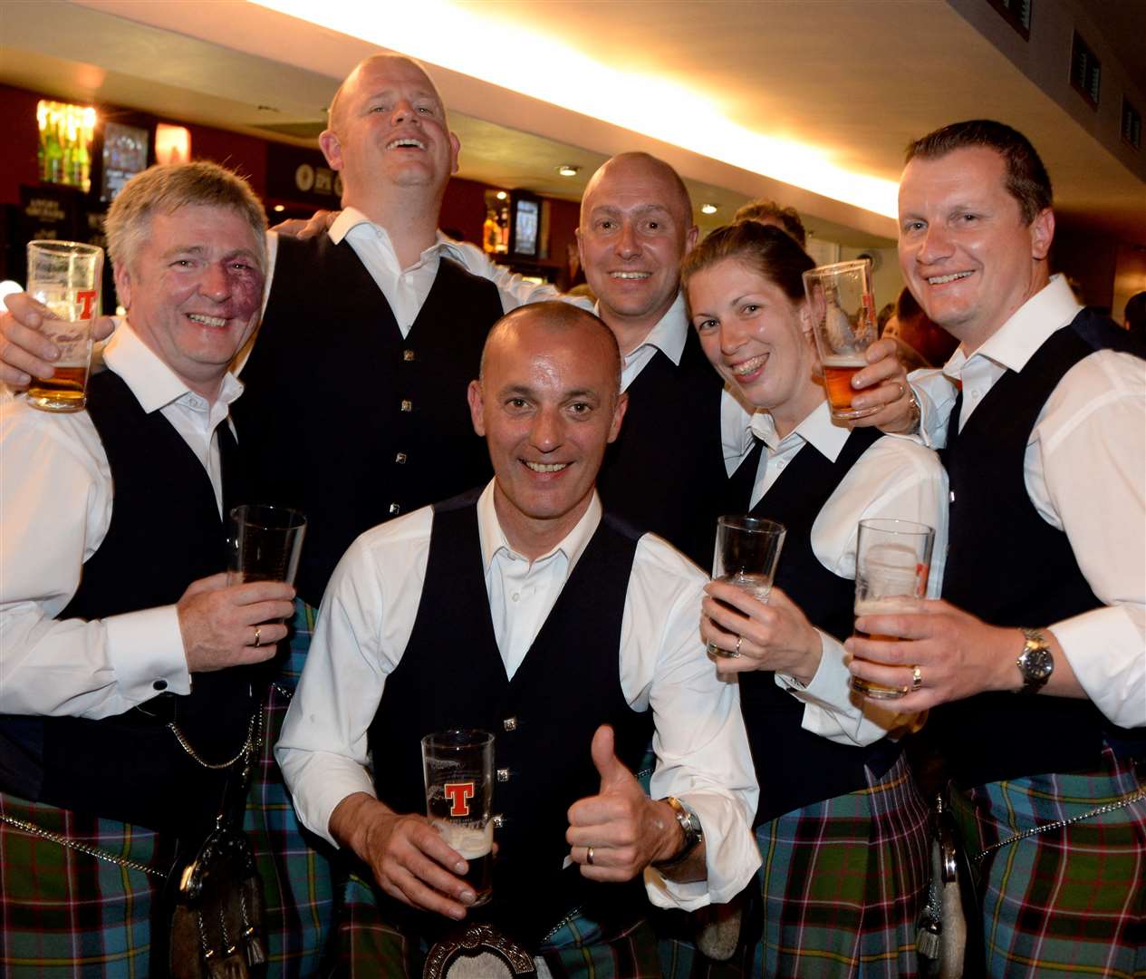 In need of a drink after competing in piping championship are the lads and lassies of Royal Burgh of Stirling pipe band