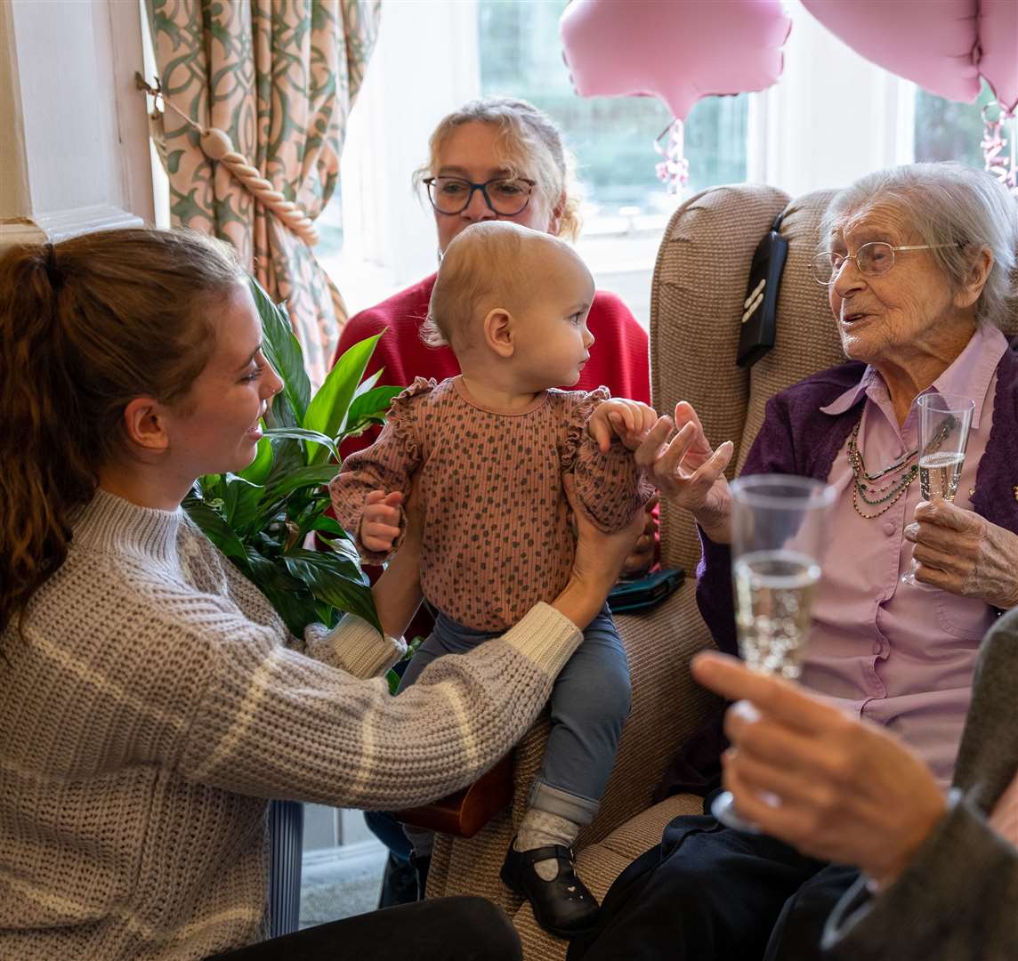 Kathleen Withall celebrating her 103rd birthday with her great-granddaughter Millie and great-great-granddaughter Nova, aged one (CHD Living/PA)