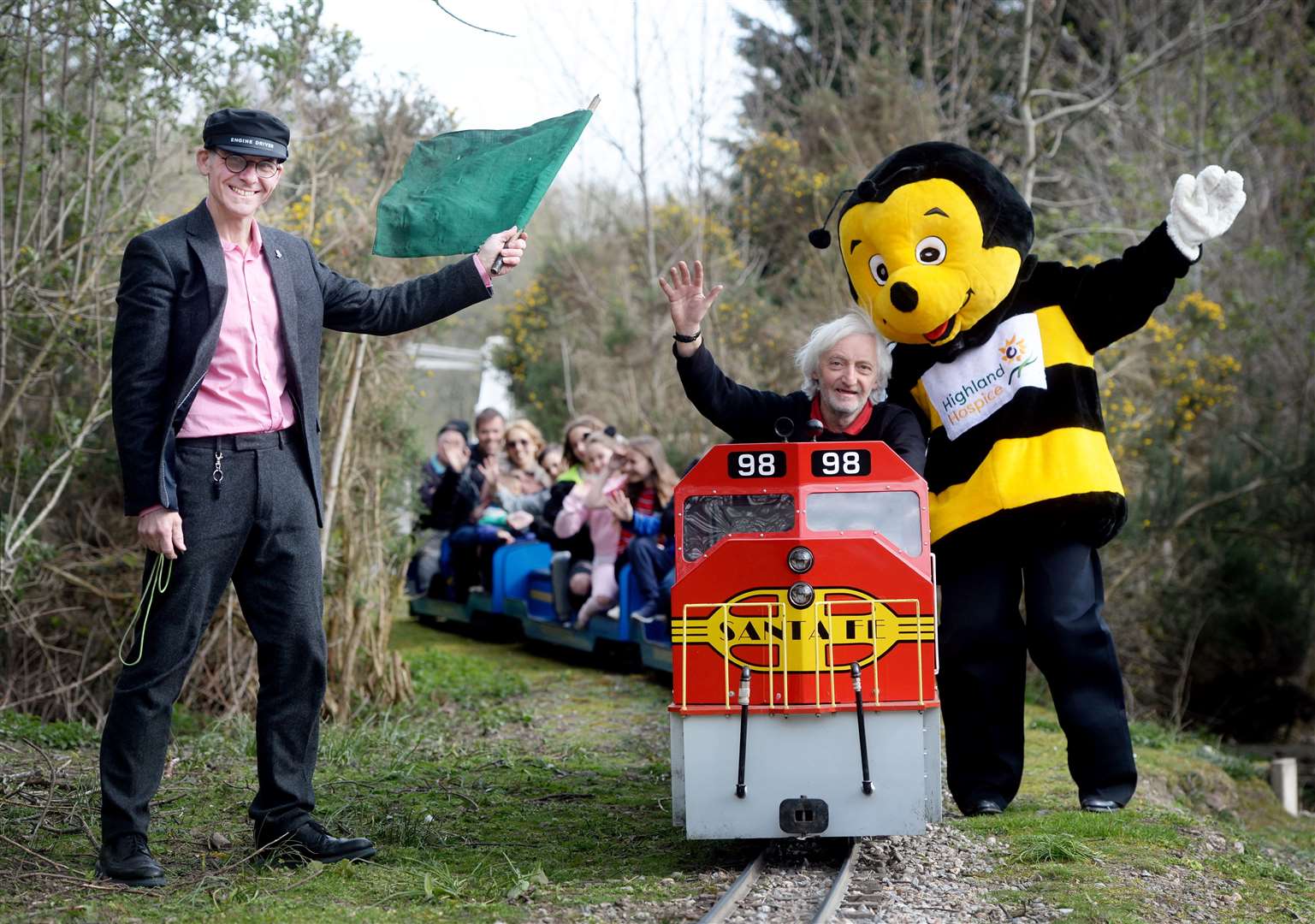 Hospice fundraising director Andrew Leaver (left), train driver Alasdair Macleod and Bobby the Bee with the miniature railway. Picture: Gair Fraser. Image No. 043719.