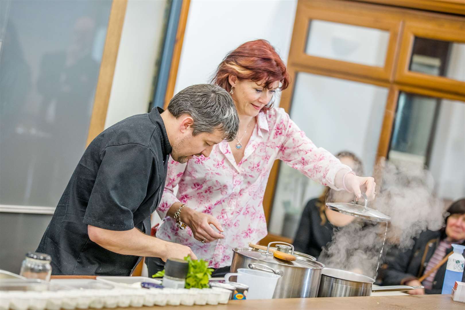Festival presenter Nicky Marr helps Jamie Ross of Redshank Catering with a cookery demonstration. Picture: Paul Campbell.