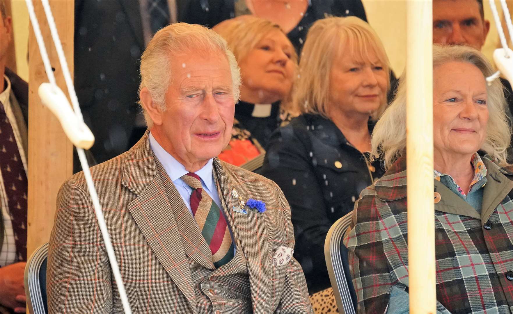 Prince Charles looks askance at the rain. Picture: DGS