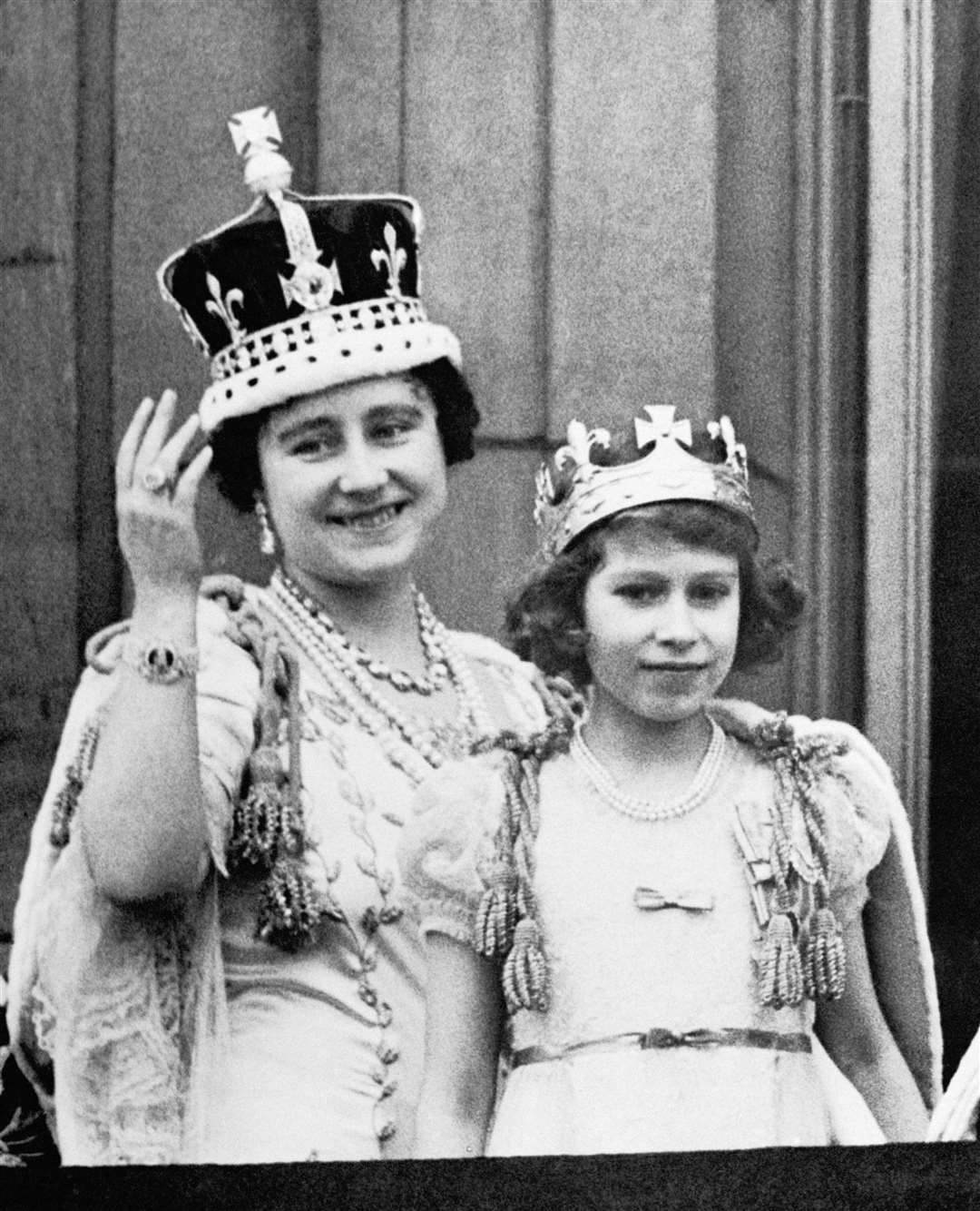Queen Elizabeth (later the Queen Mother) with her eldest daughter Princess Elizabeth (later Queen Elizabeth II) on coronation day in 1937 (PA)