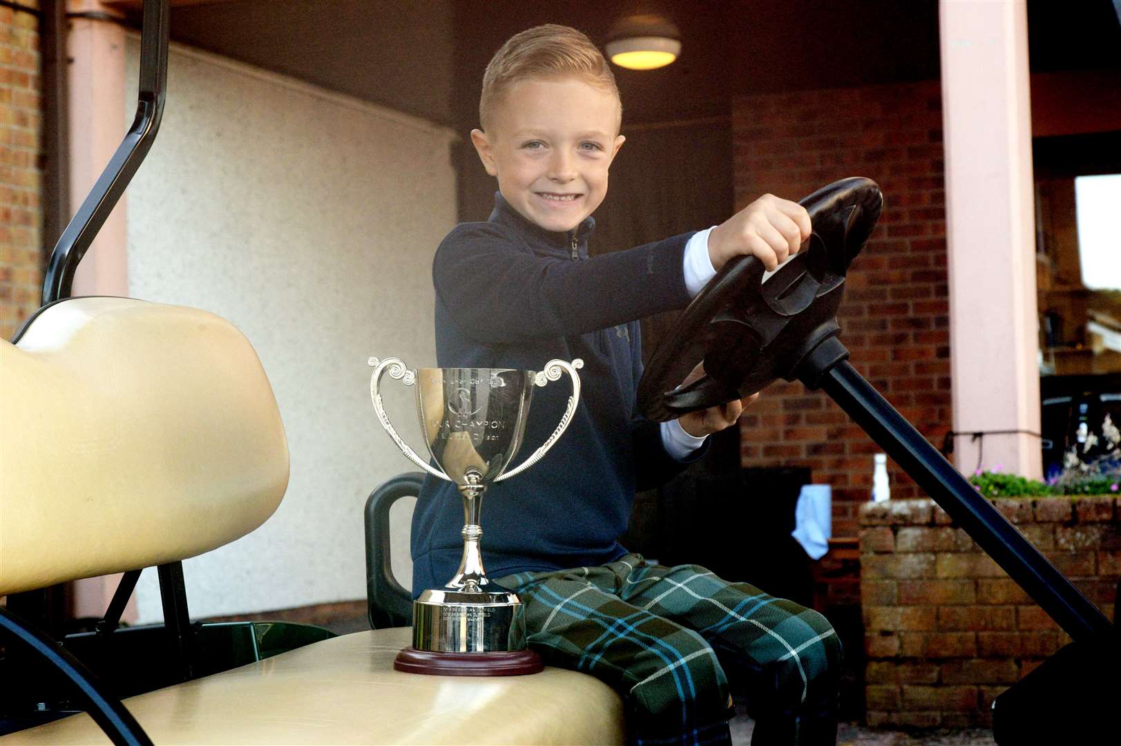 Brody MacIver in a golf buggy. Picture: James Mackenzie.