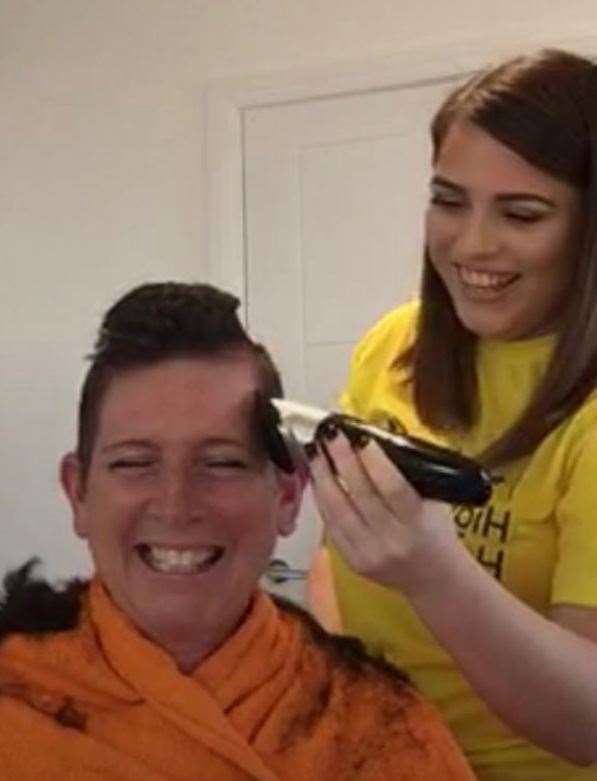 Penny O'Brien gets to work on her mother's new hairstyle.