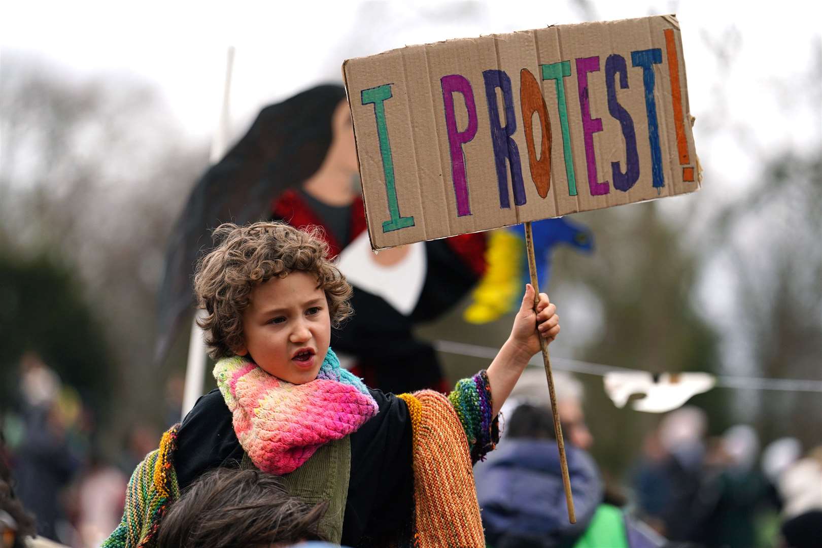 A child takes part in the demonstration (Jordan Pettitt/PA)