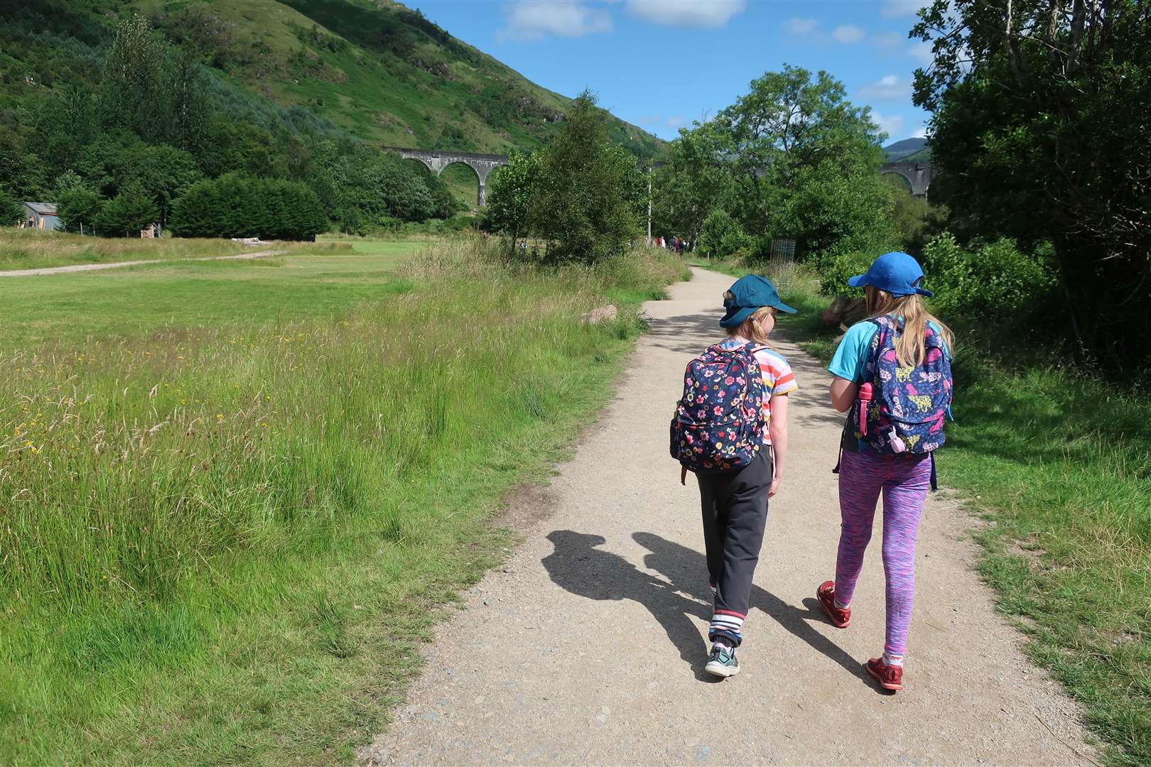 The girls make their way along the path towards the viaduct.
