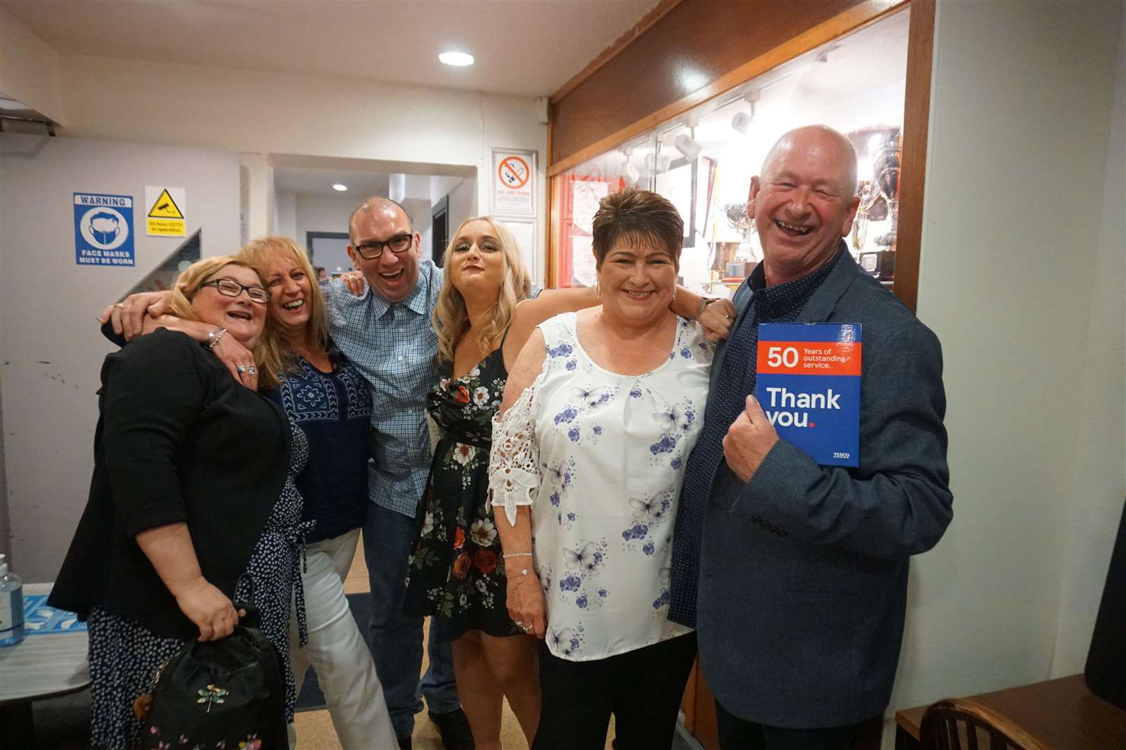 Sandy Mackenzie (right) with his wife Donna and a group of friends attending the party at Caledonian Thistle Social Club. Pictures: Federica Stefani.