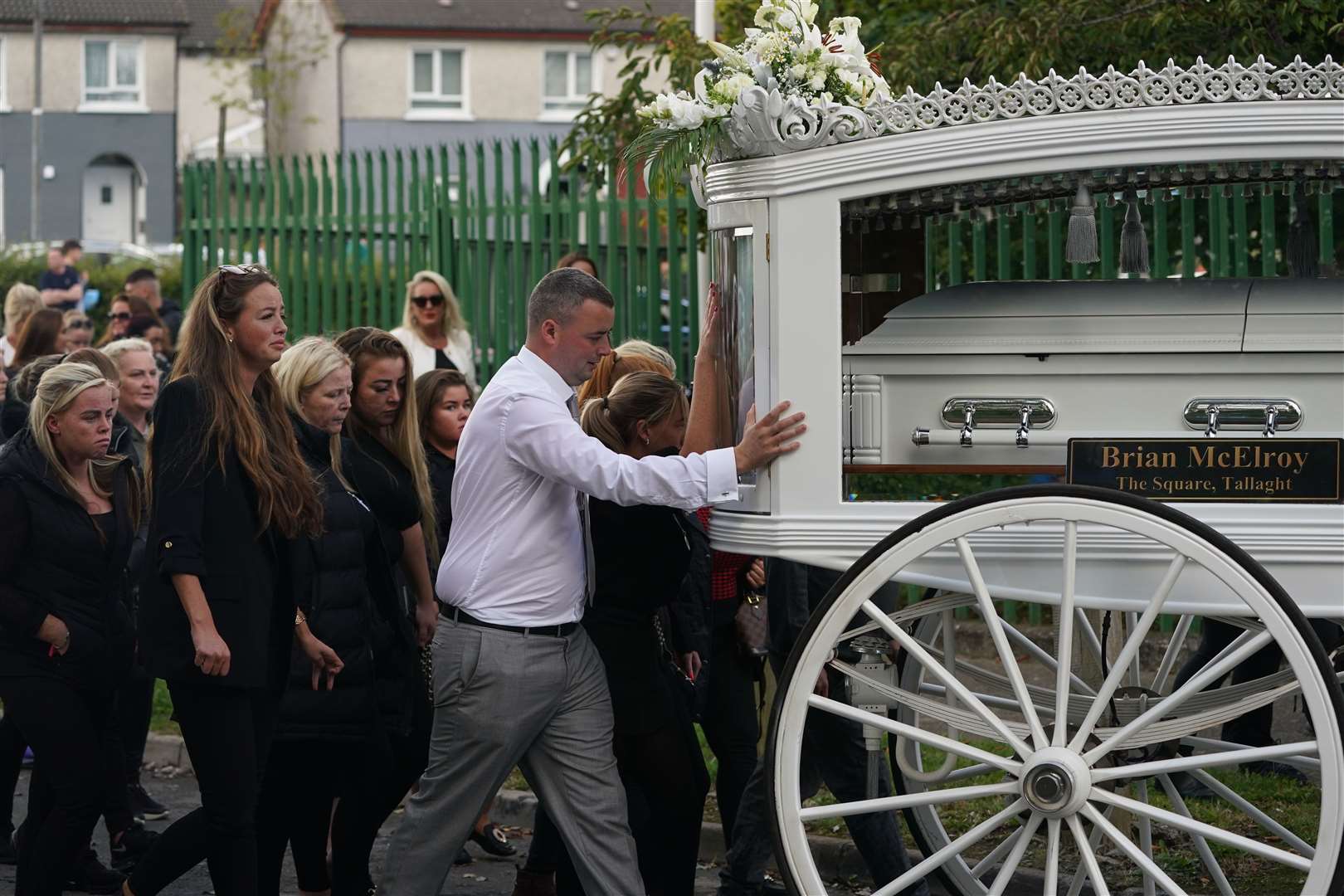 A large crowd of mourners gathered on Thursday evening outside St Aidan’s Church, Brookfield, Tallaght (Brian Lawless/PA)