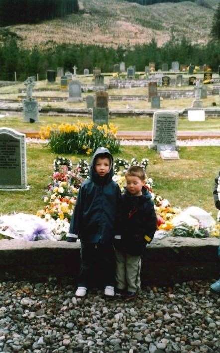 Andrew Wilson and his brother the graveside.