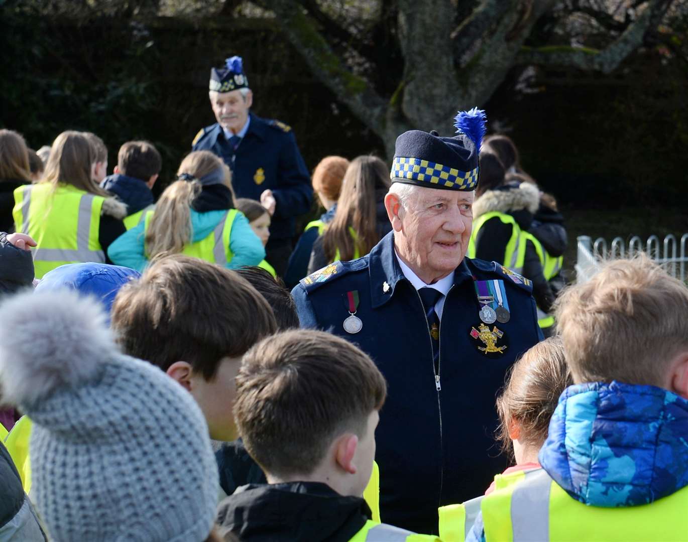 David Taylor, president of the Inverness Branch of the RBLS talks to pupils about the history of the memorial.