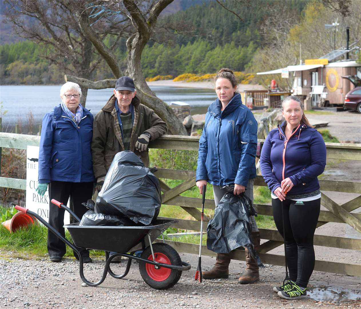 Litter at Dores..Residents from Dores with latest wheelbarrow of litter off the beach..Ella and Derek MacRae with Fiona Cairns and Claire Driver...Picture: Gary Anthony..