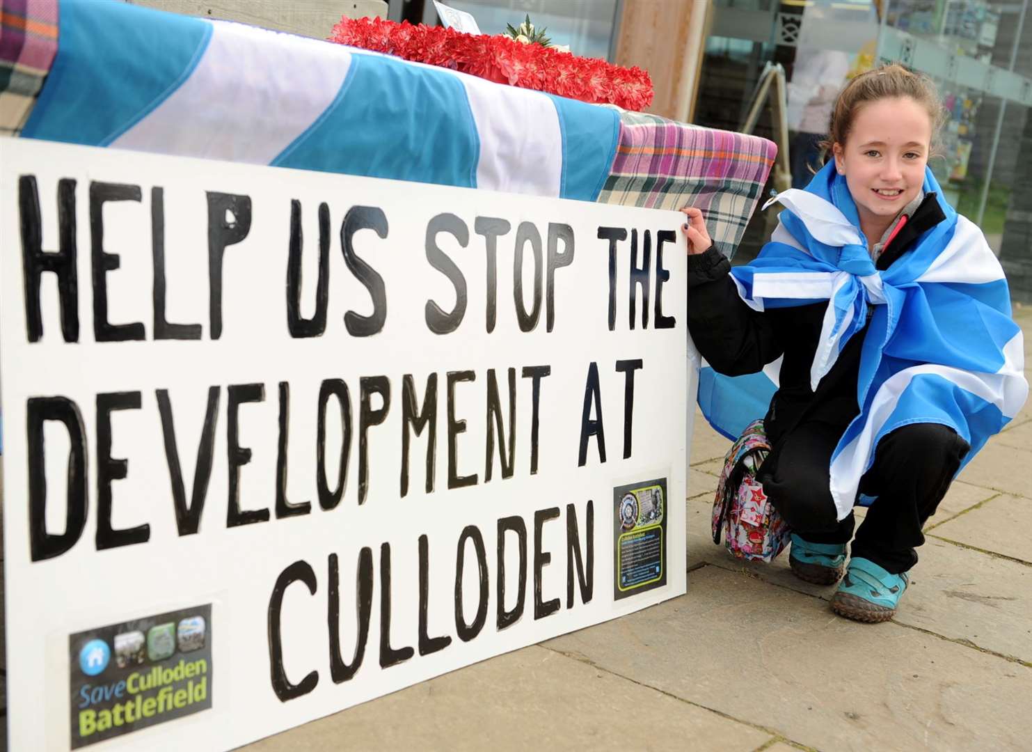 Protest march at Culloden Battlefield against the development by Inverness Properties , Ciara Esplin-Logan(10) shows her support . . . . . Picture: Gary Anthony. Image No.024861.