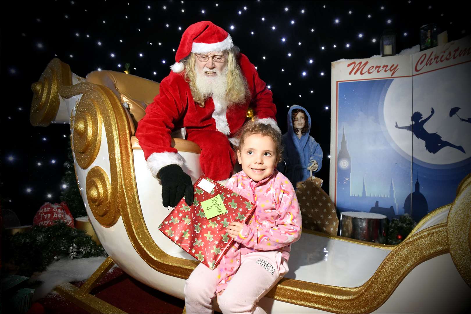 Sophia Shayar getting a gift from Santa. Picture: James Mackenzie