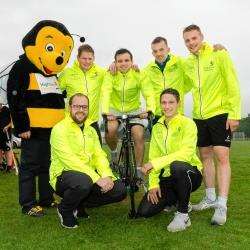 The Highland Hospice's Bobby the bumblebee with Lovat players who are raising funds through a sponsored cycle.
