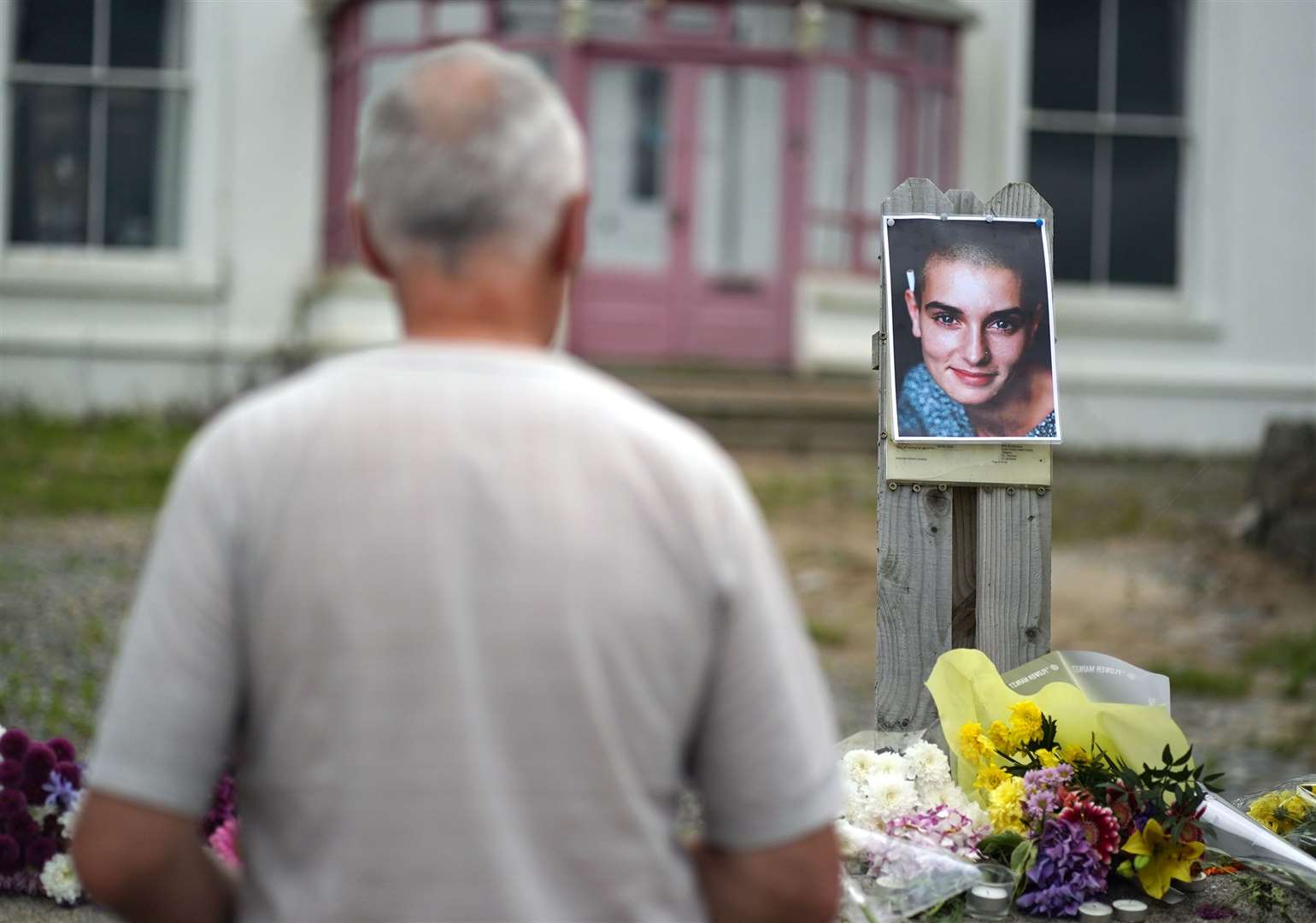 Floral tributes laid outside Sinead O’Connor’s former home in Bray, Co Wicklow (Brian Lawless/PA)