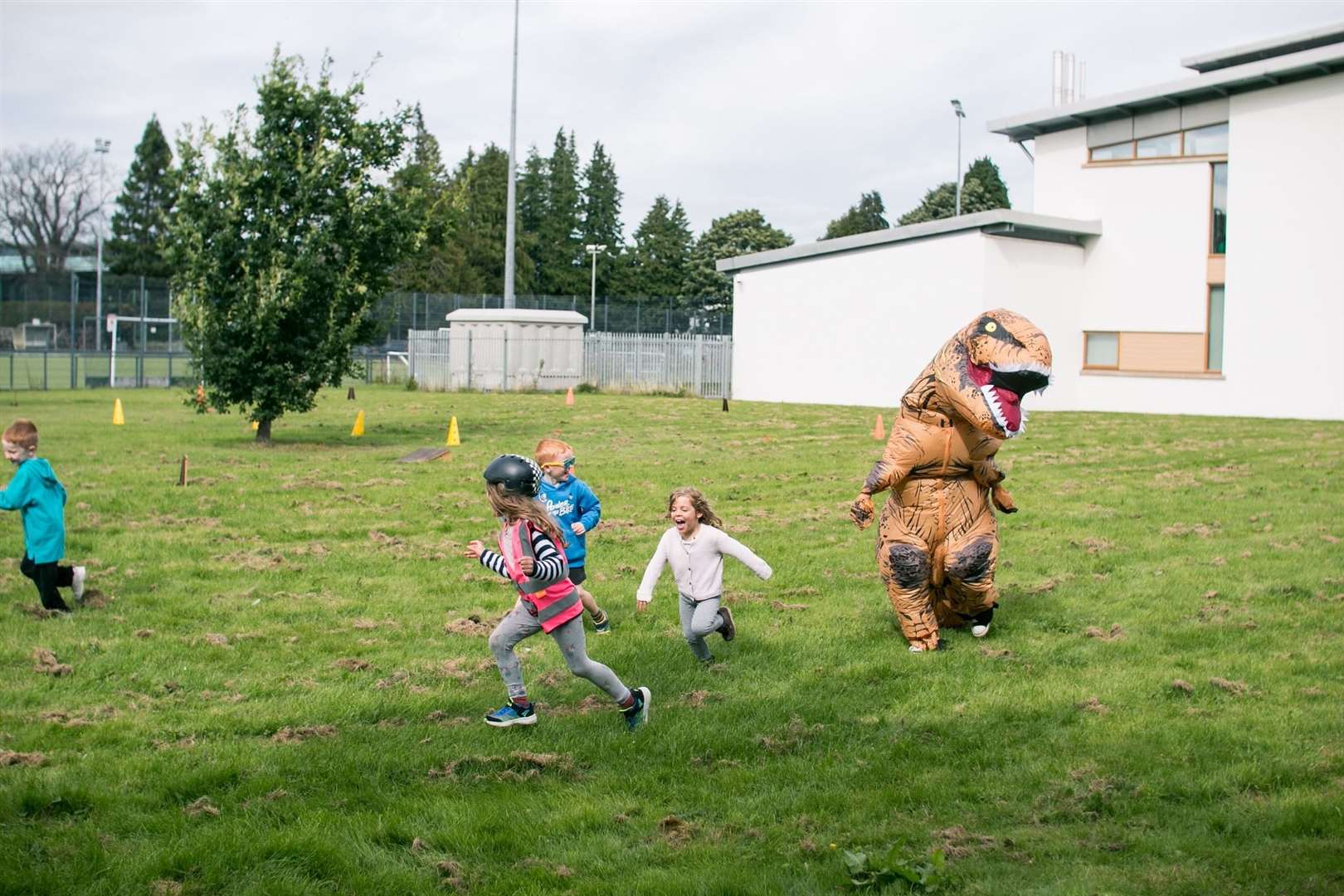 Little ones enjoyed being chased by the Kidical Mass dinosaurs. Picture: Katie Noble