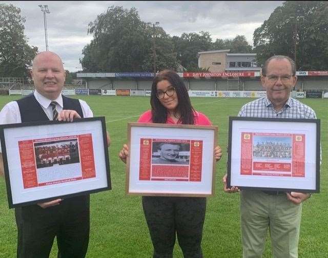 Ian Davidson, right, with Jessica Milne of Nairn County's social media team, with club secretary Ian Finlayson displaying the plaques.