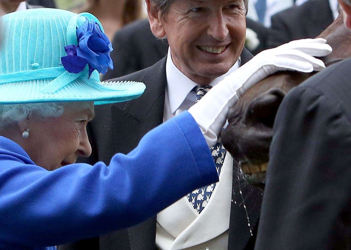 The Queen greets Dartmouth, in the winners’ enclosure, after winning the Hardwicke stakes at Royal Ascot 2016 (Steve Parsons/PA)
