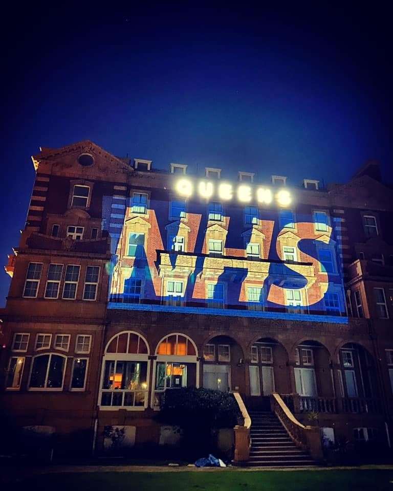 THERE FOR YOU: Queen’s Hotel lit up for NHS and preparing food in the kitchen.