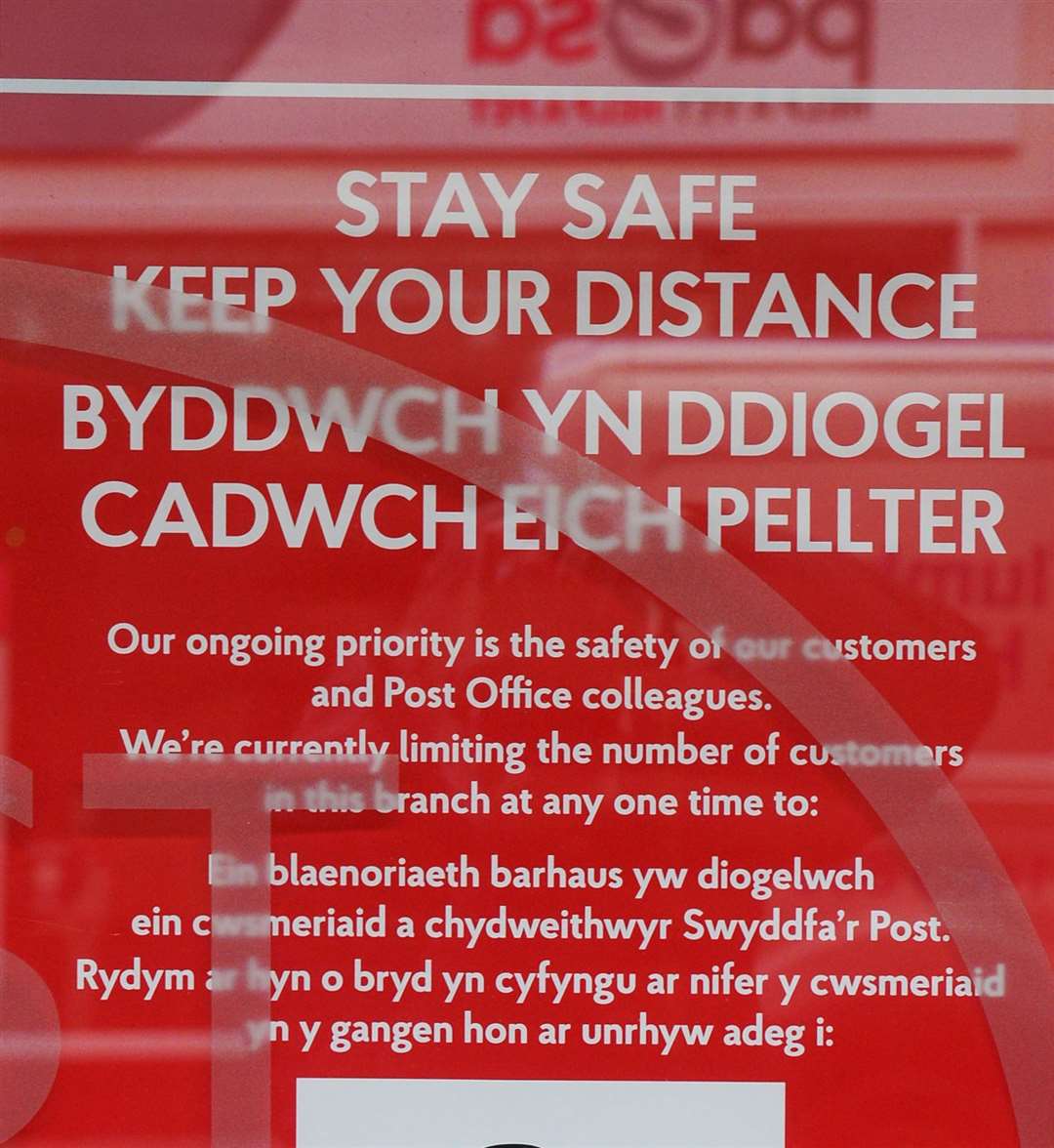 Welsh distancing sign on door of Post Office Queensgate..Picture: Gary Anthony..