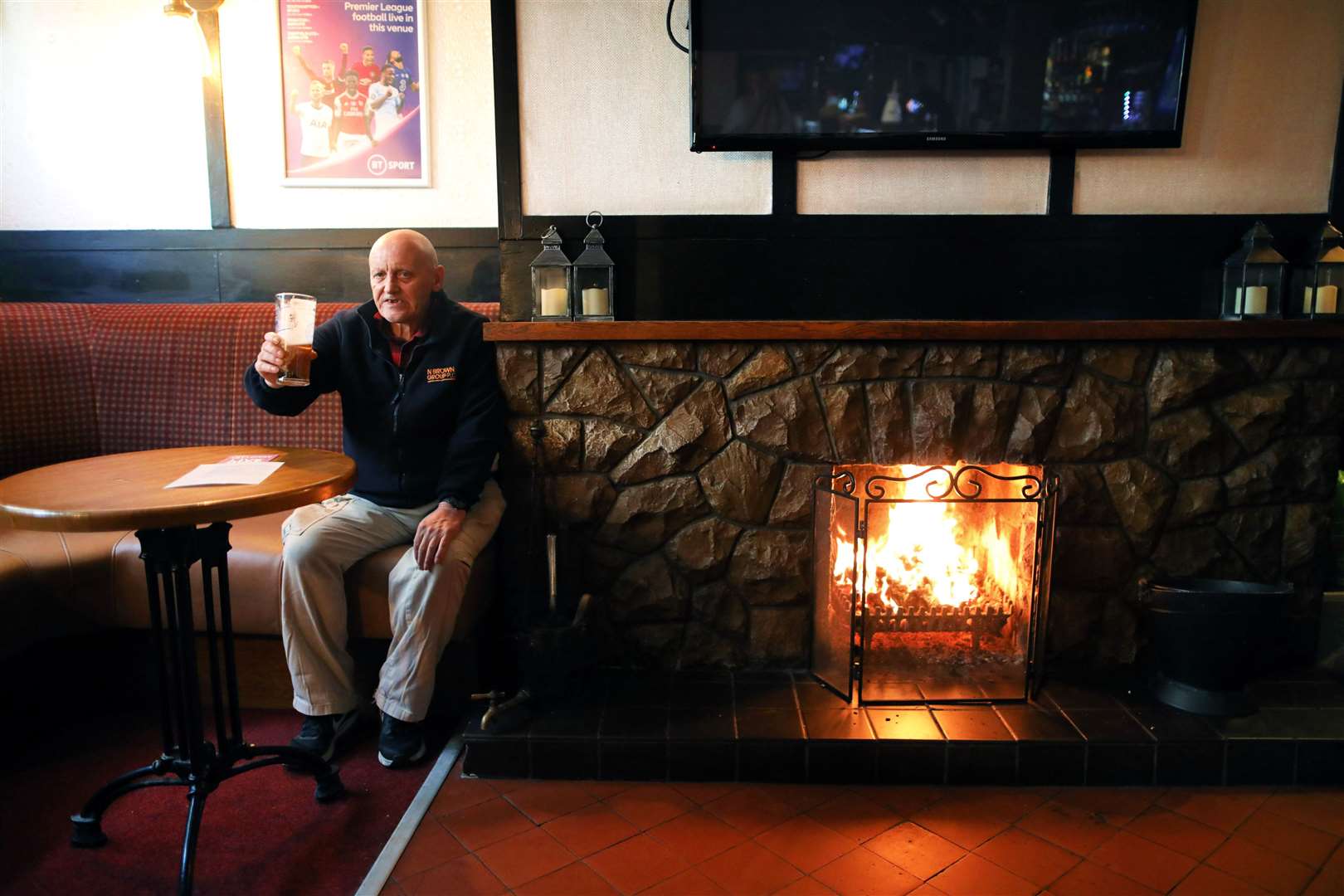 Phil Goldstraw enjoys a pint in the Hole in the Wall pub in Armagh as it reopened in September after Covid-19 restrictions (Peter Morrison/PA)